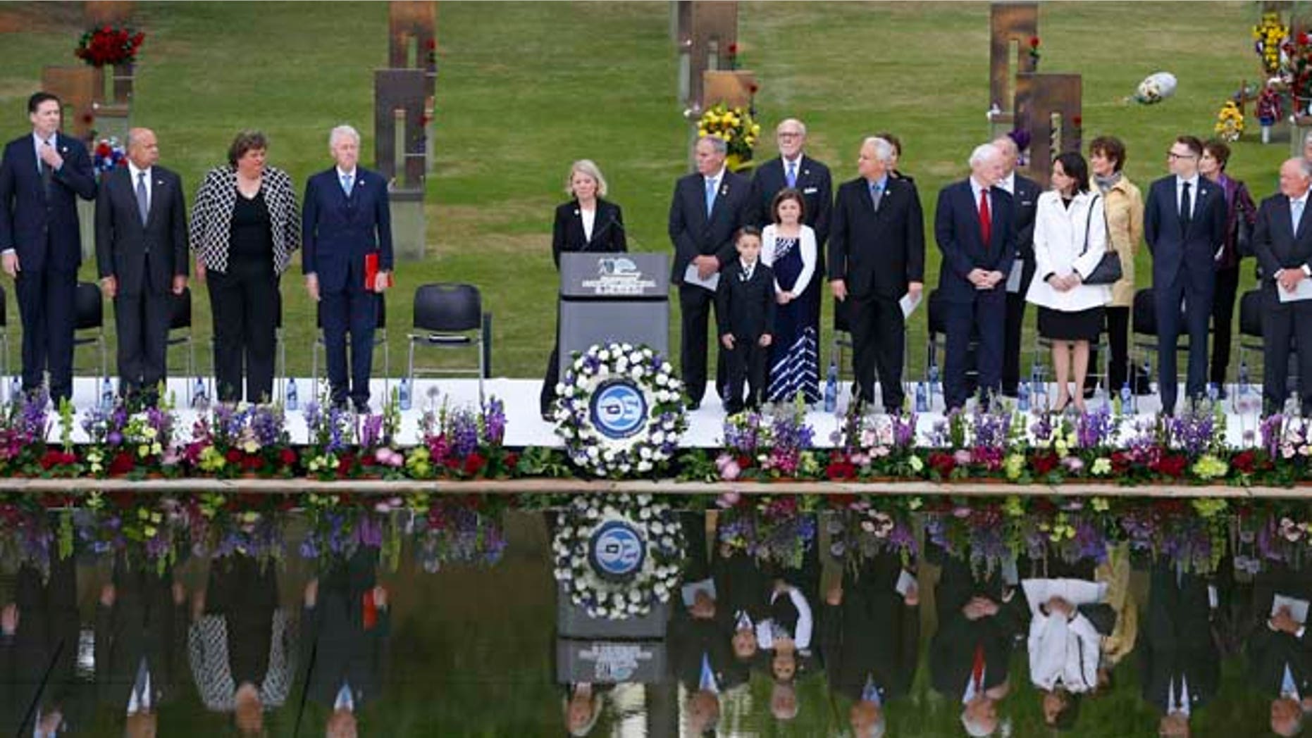 April 19, 2015: Speakers, including former President Bill Clinton, fourth from left, stand at the opening of ceremonies to commemorate the 20th anniversary of the Oklahoma City bombing, at the Oklahoma City National Memorial, in Oklahoma City.
