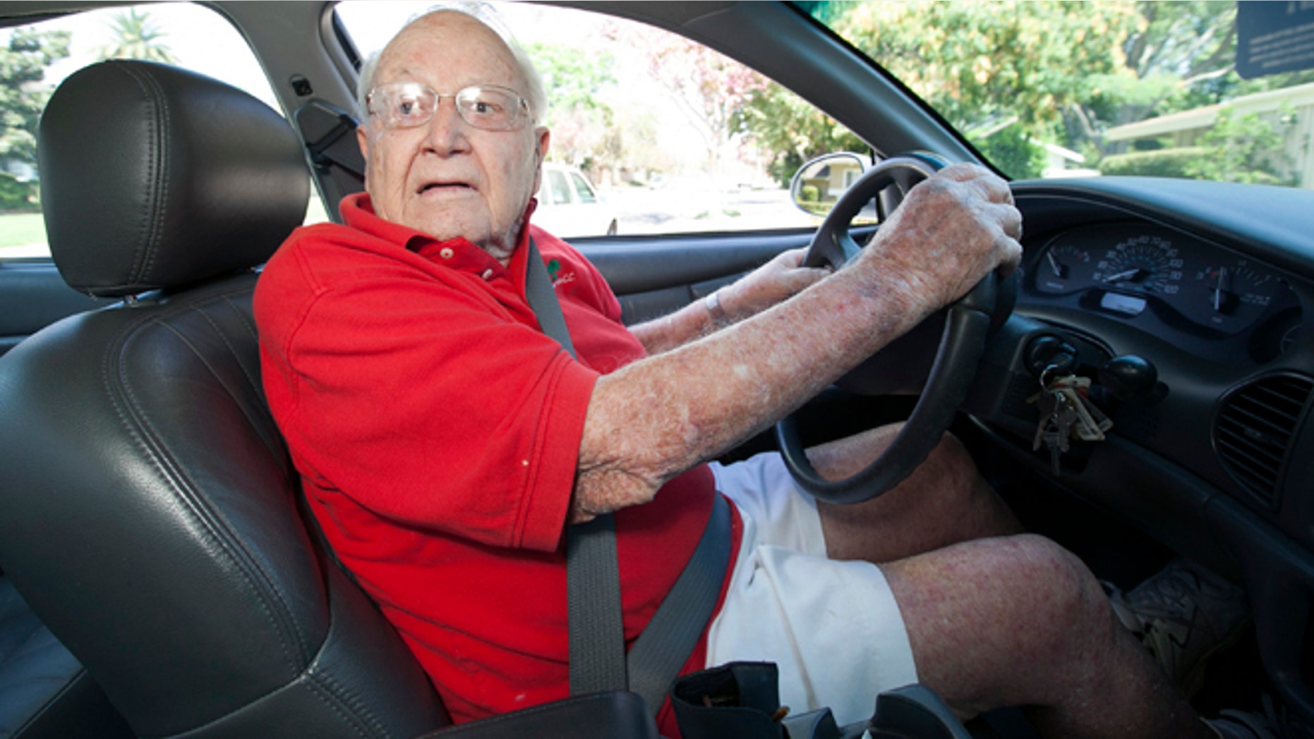 Jack Wyrad, 92, reverses his GM Buick in Los Angeles Thursday, Aug. 30, 2012. Wyard, who got a perfect score on his written test for his license two years ago, says he believes older people should make their own decisions on when to quit driving. On Thursday another licensed Los Angeles driver, 100 years old, accidentally backed his Cadillac into a group of schoolchildren, injuring 11 people. The accident has renewed a debate over when elderly people should quit driving. (AP Photo/Damian Dovarganes)