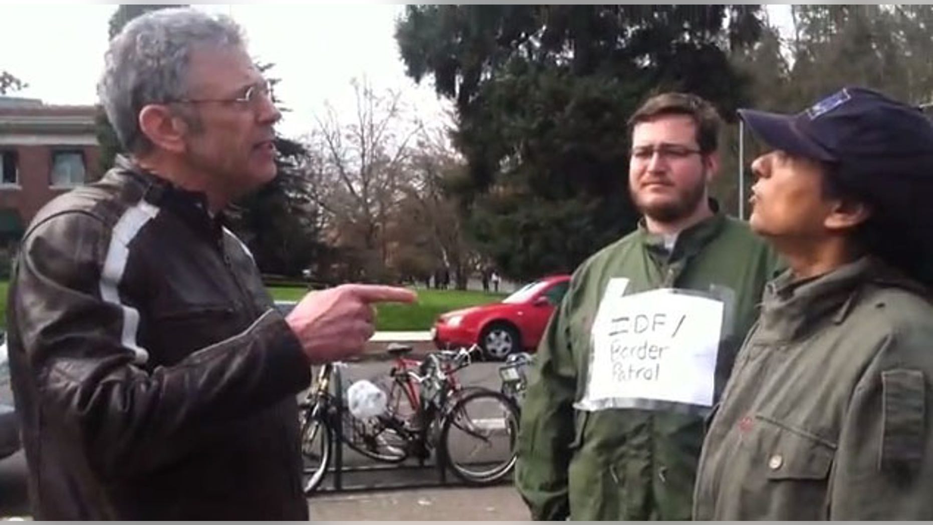 Adjunct Law Professor James Olmstead (left) was fired from the University after a heated exchange with student protesters