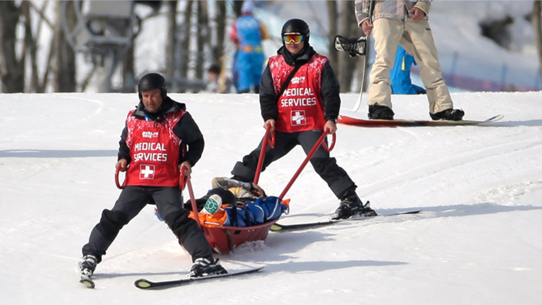 Feb. 16, 2014: Jacqueline Hernandez of the United States is carried off the course in a stretcher after crashing in a seeding run during women's snowboard cross competition at the Rosa Khutor Extreme Park, at the 2014 Winter Olympics.
