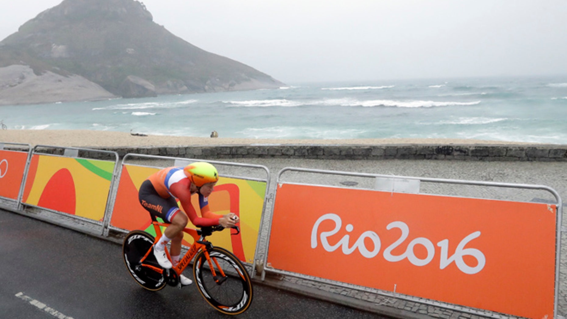 Cyclist Ellen van Dijk of Netherlands rides along Pontal beach during the women's individual time trial event at the 2016 Summer Olympics in Rio de Janeiro, Brazil, Wednesday, Aug. 10, 2016.