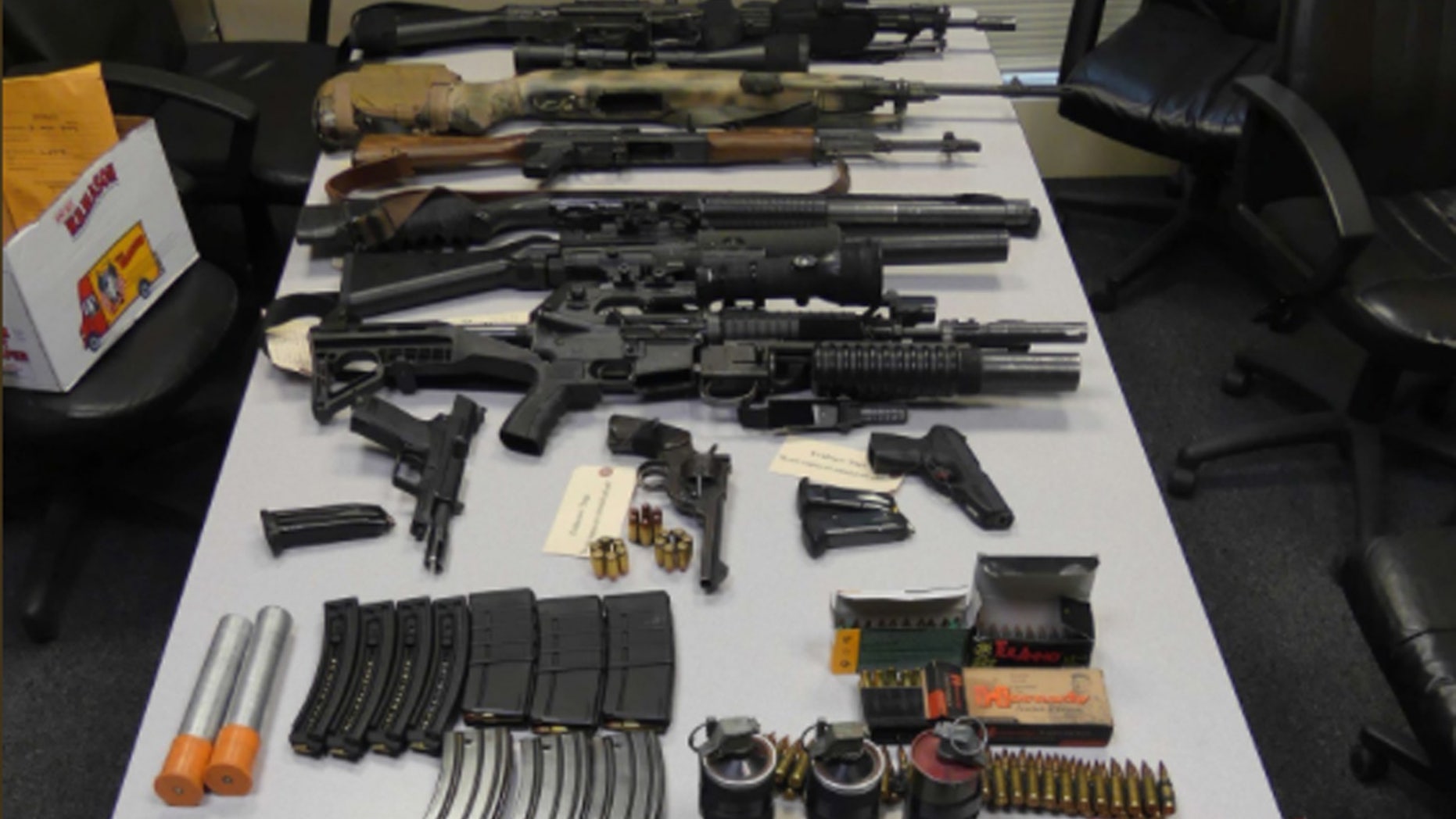 Massachusetts authorities posted a picture on Twitter showing a weapons stockpile discovered at a Boston-area hotel.