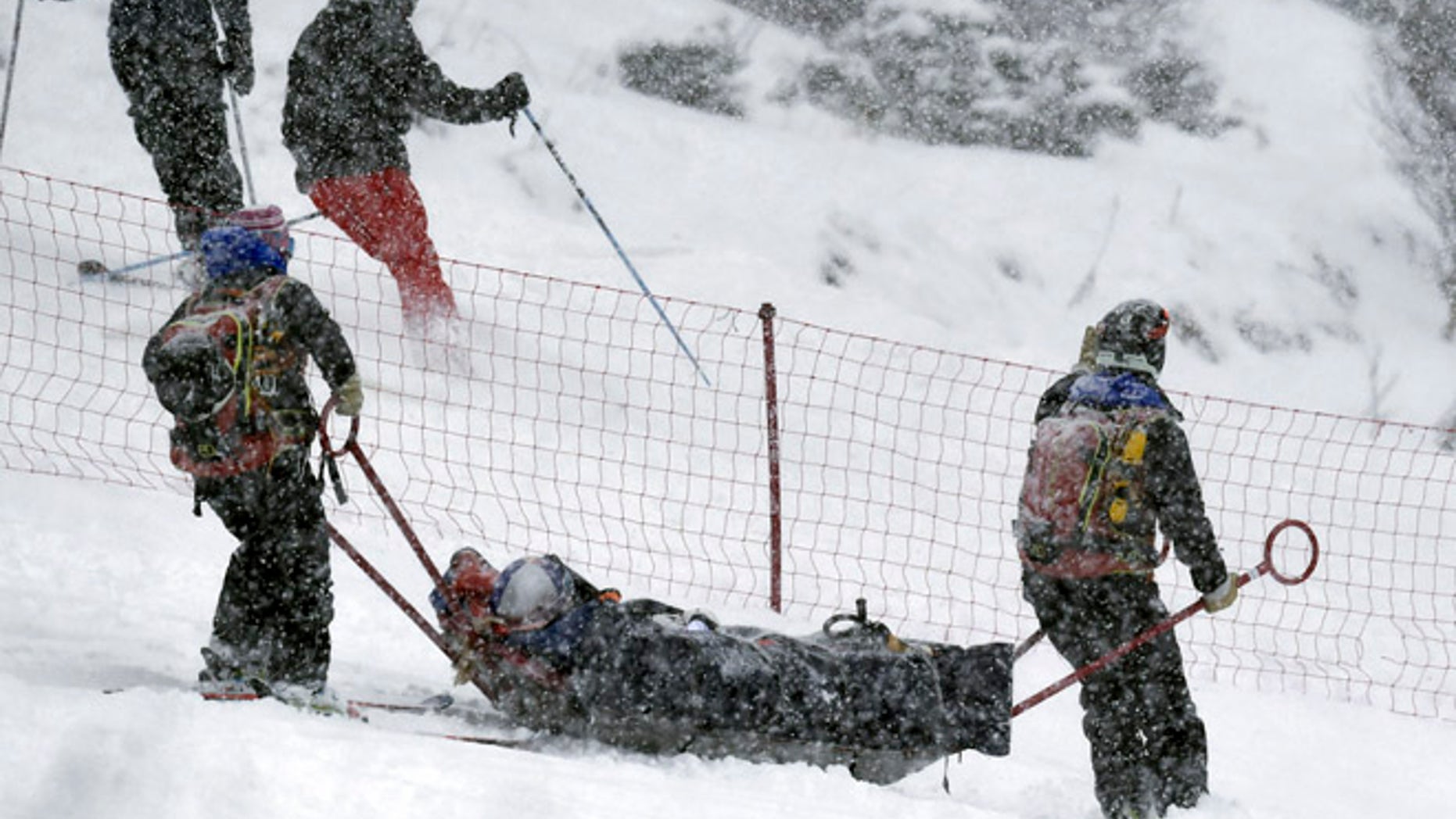 Lindsey Vonn, of the United States, is being carried out of the course on a rescue sled after falling during a women's World Cup alpine ski super G race, in Soldeu, Andorra, Saturday, Feb. 27, 2016. (AP Photo)