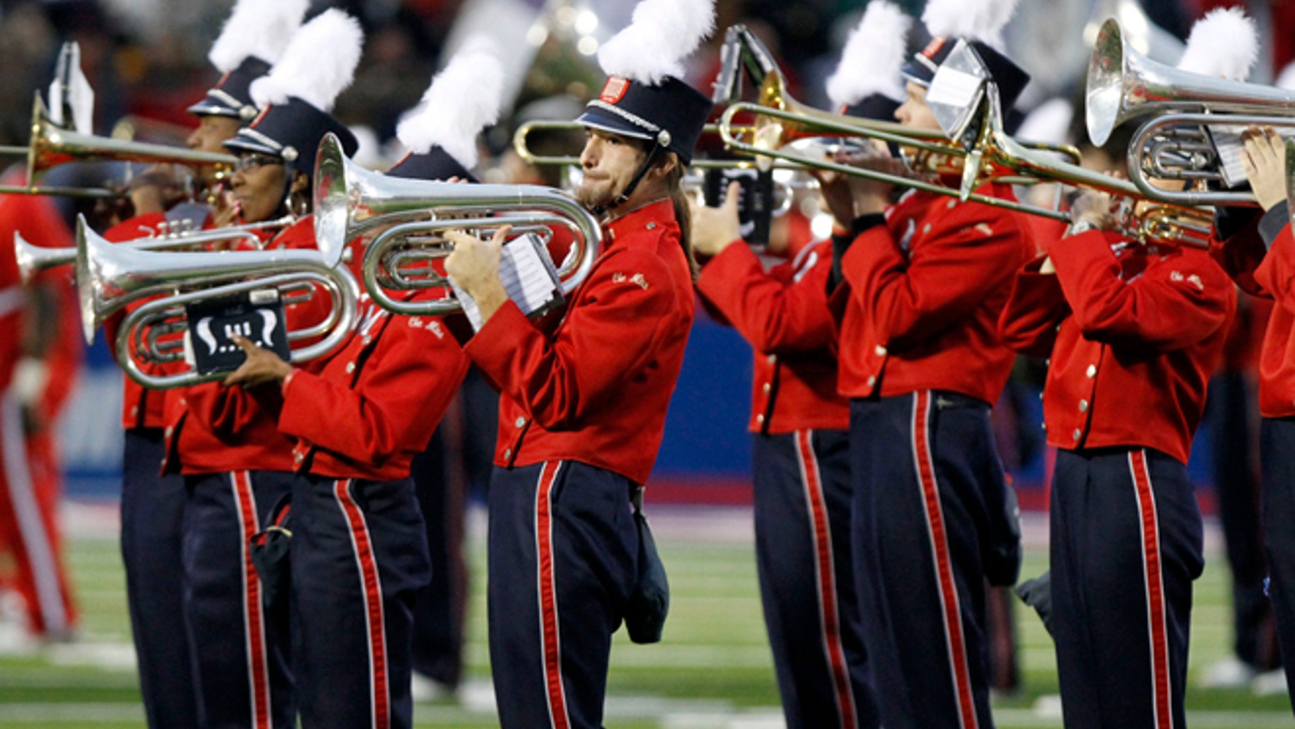 In this Oct. 17, 2009 photo taken before the NCAA college football game in Oxford, Miss., the University of Mississippi band, "The Pride of the South," play the national anthem in Oxford, Miss.