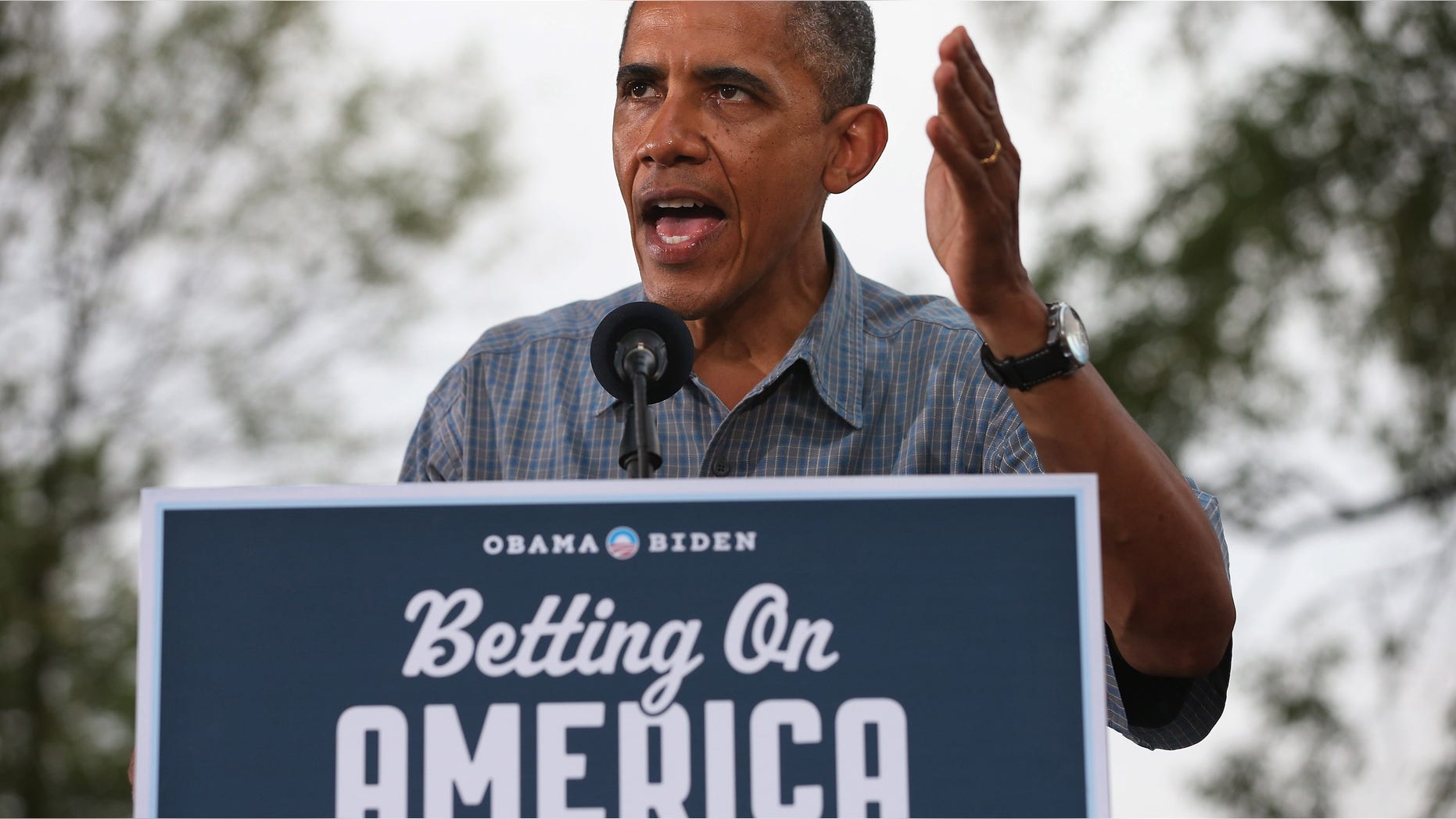 PARMA, OH - JULY 05: U.S. President Barack Obama delivers remarks during a campaign "grassroots event" at James Day Park July 5, 2012 in Parma, Ohio. Obama is traveling by bus through Northern Ohio and Western Pennsylvania for a "Betting on America" campaign tour. The president highlighted his administration?s efforts to improve the economy by creating manufacturing jobs and rescuing the American auto industry while taking swings at the presumptive Republican presidential nominee, former Massachusetts Gov. Mitt Romney. (Photo by Chip Somodevilla/Getty Images)