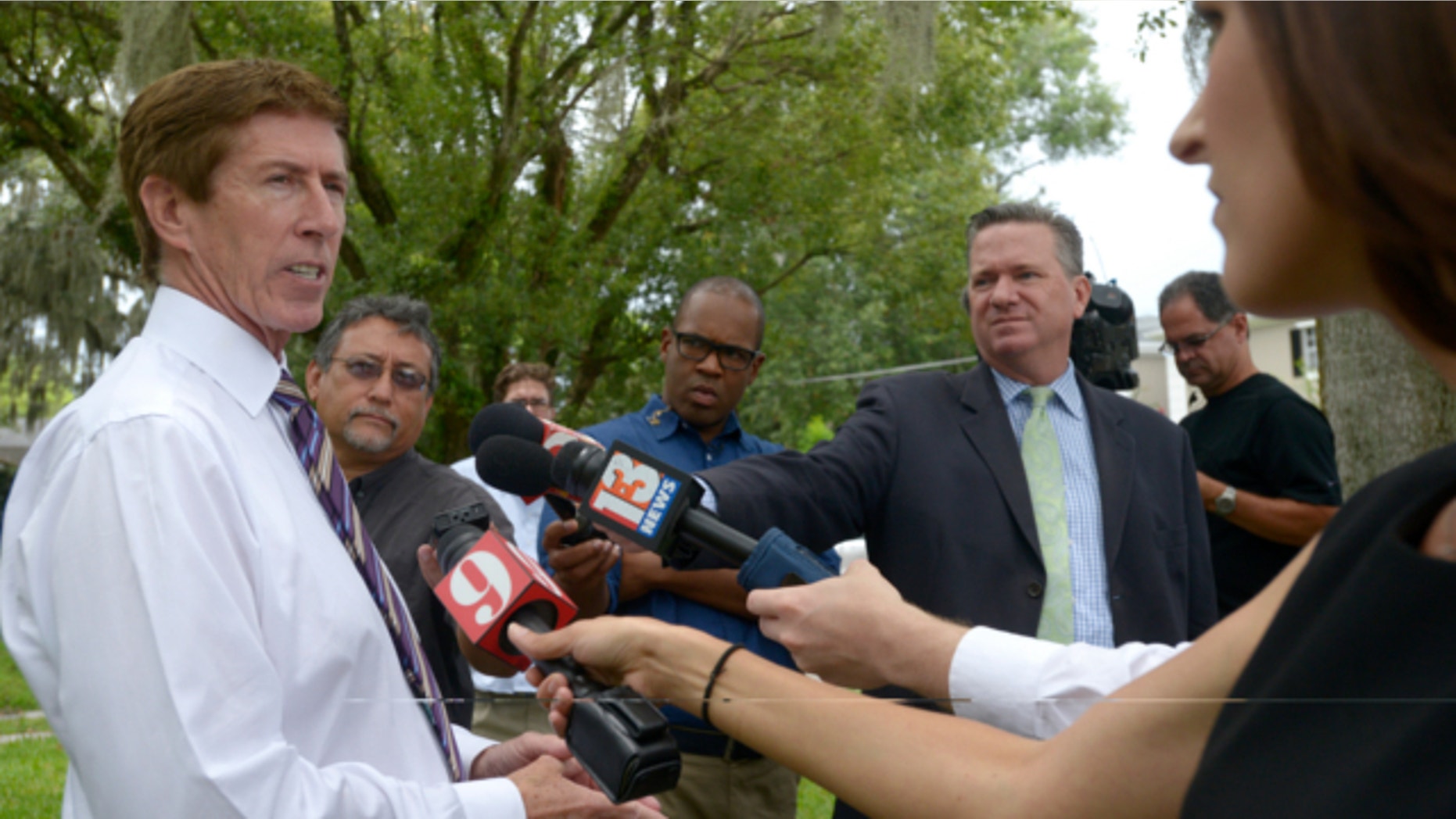 July 24, 2013: George Zimmerman attorney Mark O'Mara answers questions from reporters outside his offices in Orlando, Fla.