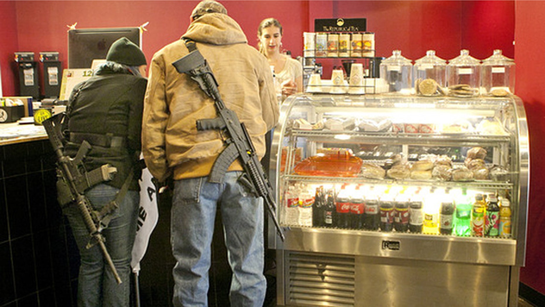 December 7, 2013: Stephanie McDonald and James Franklin buy coffee while participating in an open carry demonstration in Texas (AP).
