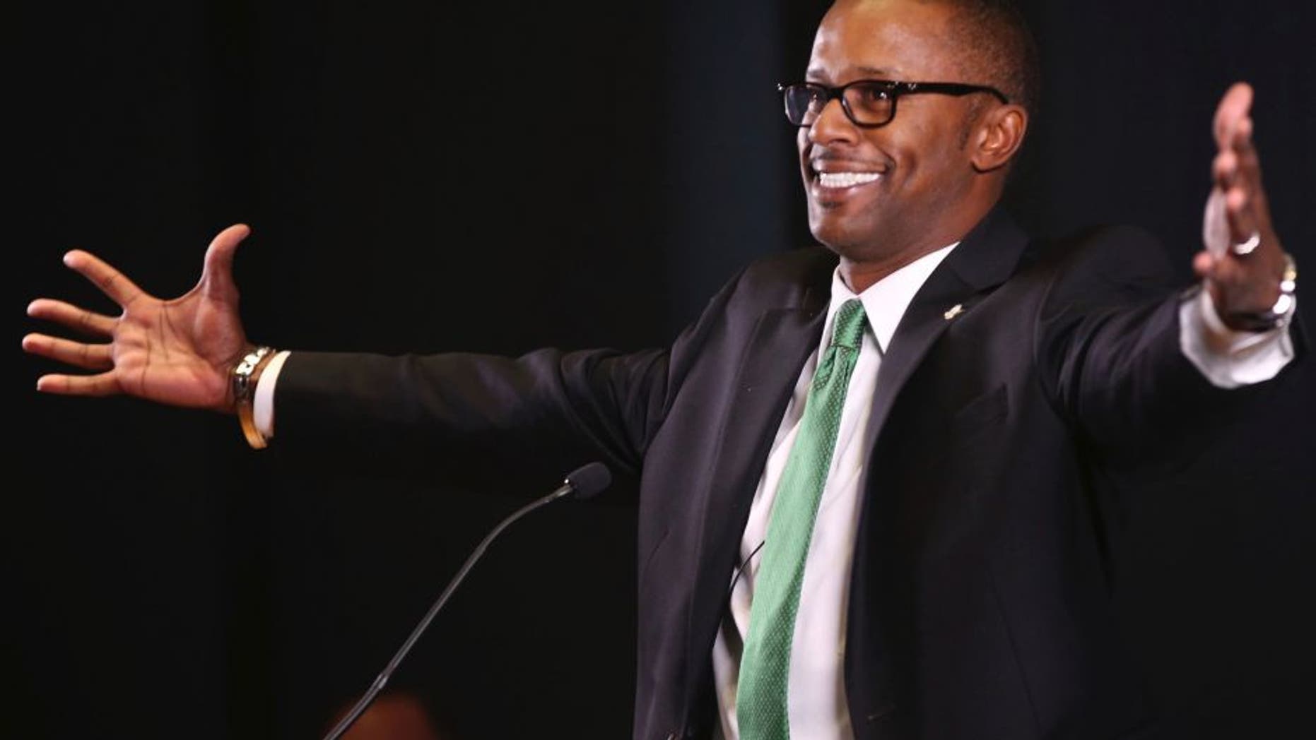 New University of Oregon NCAA college football coach Willie Taggart jokes with the audience during an introductory press conference in Eugene, Ore., Thursday Dec. 8, 2016. (Chris Pietsch/The Register-Guard via AP)