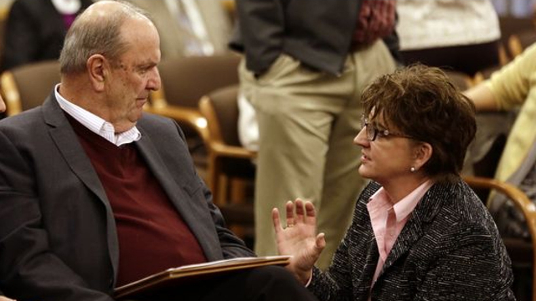 FILE: Nov. 20, 2013: Cover Oregon executive director Rocky King, left, confers with Oregon Health Authority Chief Information Officer Carolyn Lawson before appearing at a Joint Interim Committee on Legislative Audits, Information Management and Technology in Salem, Ore.