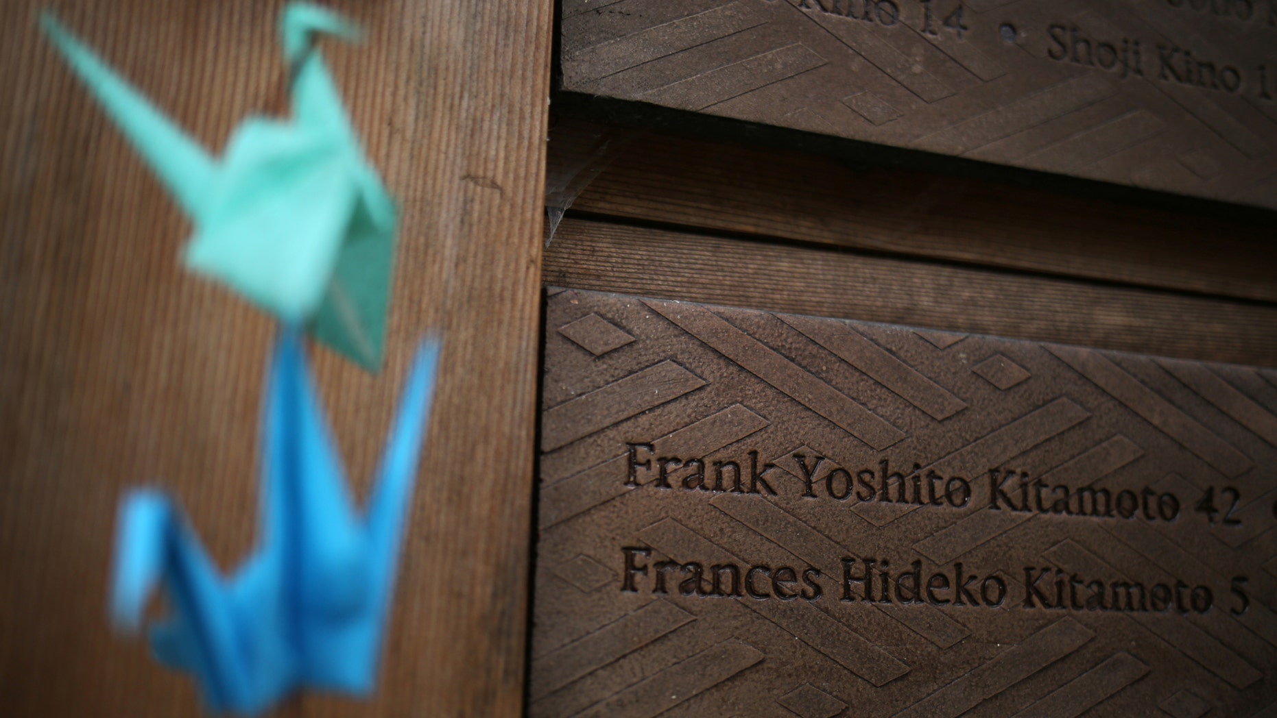 File photo: Origami cranes hang near names of some of the 227 men, women and children who were marched off the island to camps in 1942, at the Japanese American Exclusion Memorial on Puget Sound's Bainbridge Island, Washington, U.S. February 12, 2017. (REUTERS/Chris Helgren)