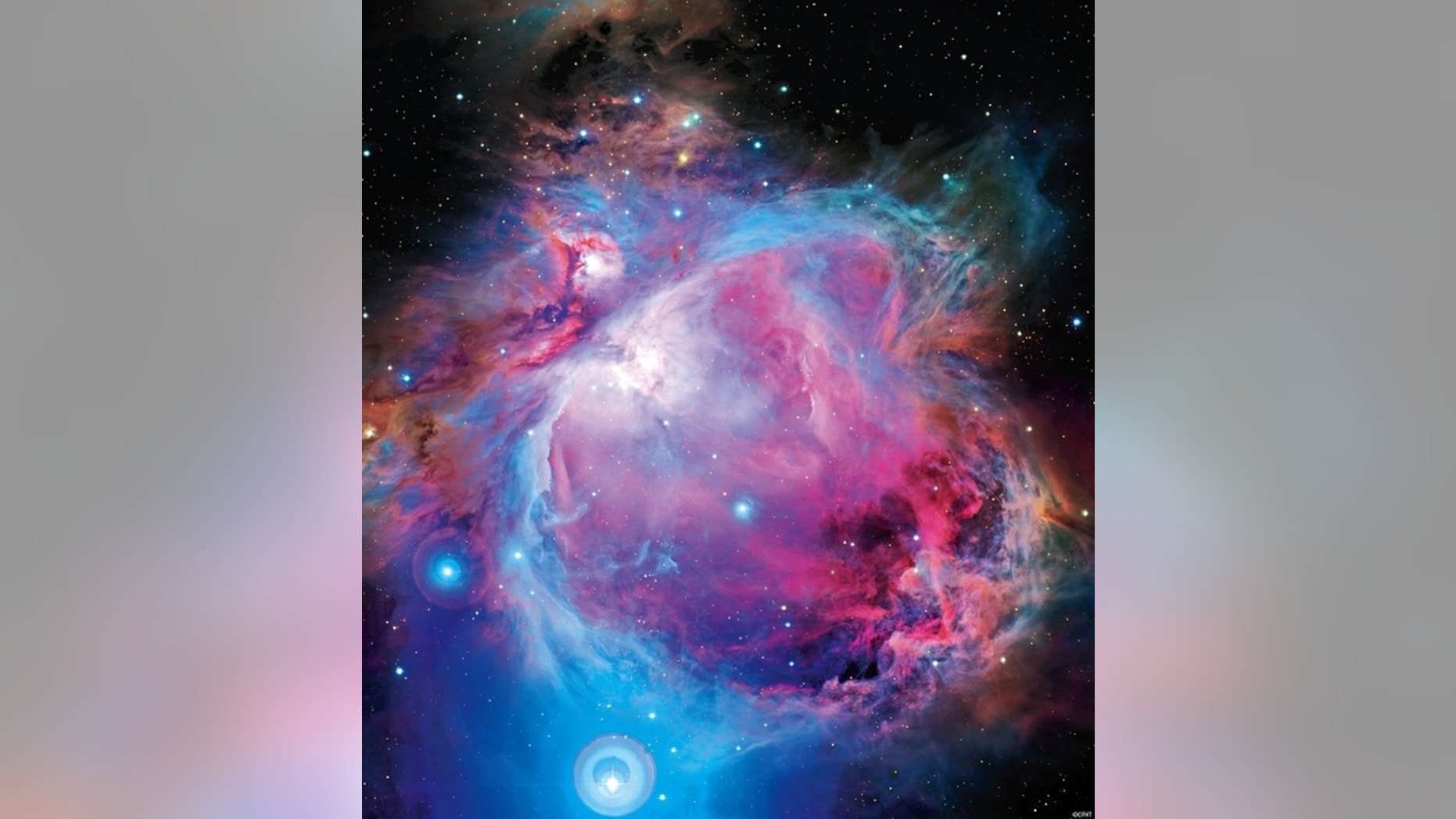 Once thought to be part of the Orion nebula, the star cluster NGC 1980 is actually a separate entity, scientists say. It appears around the brightest star seen at the bottom of this image, iota Ori. The disks around the star are the result of i
