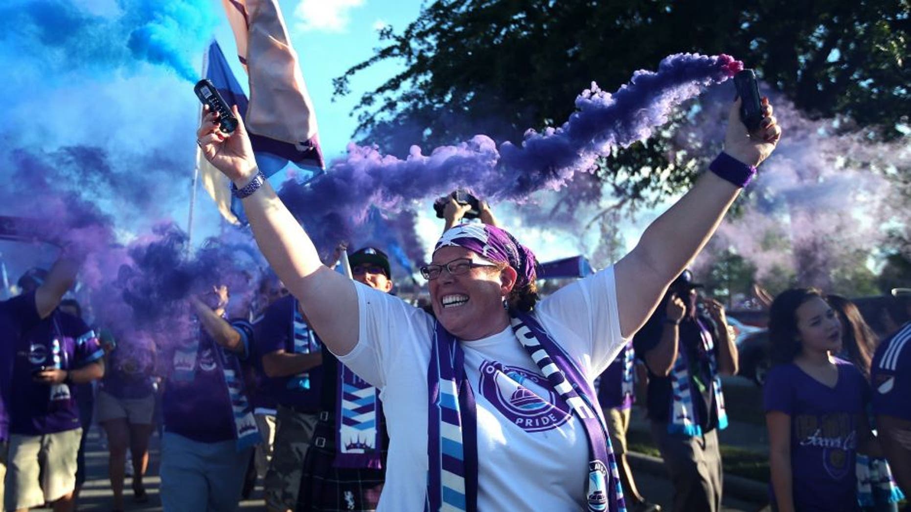 ORLANDO, FL - APRIL 23: Orlando Pride supporters march to the stadium prior to a NWSL soccer match between the Houston Dash and the Orlando Pride at the Orlando Citrus Bowl on April 23, 2016 in Orlando, Florida. (Photo by Alex Menendez/Getty Images) *** Local Caption ***