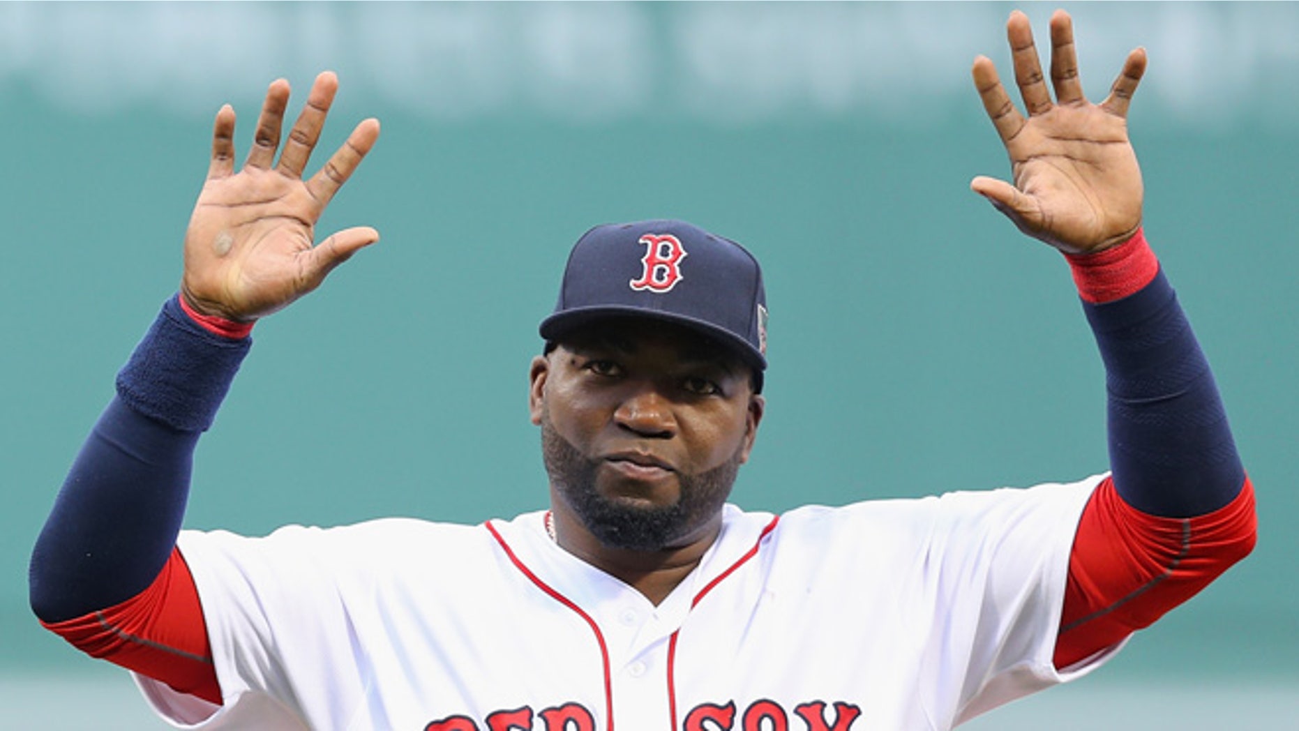 BOSTON, MA - OCTOBER 02: David Ortiz #34 of the Boston Red Sox acknowledges the crowd during the pregame ceremony to honor his retirement before his last regular season home game at Fenway Park on October 2, 2016 in Boston, Massachusetts. (Photo by Maddie Meyer/Getty Images)