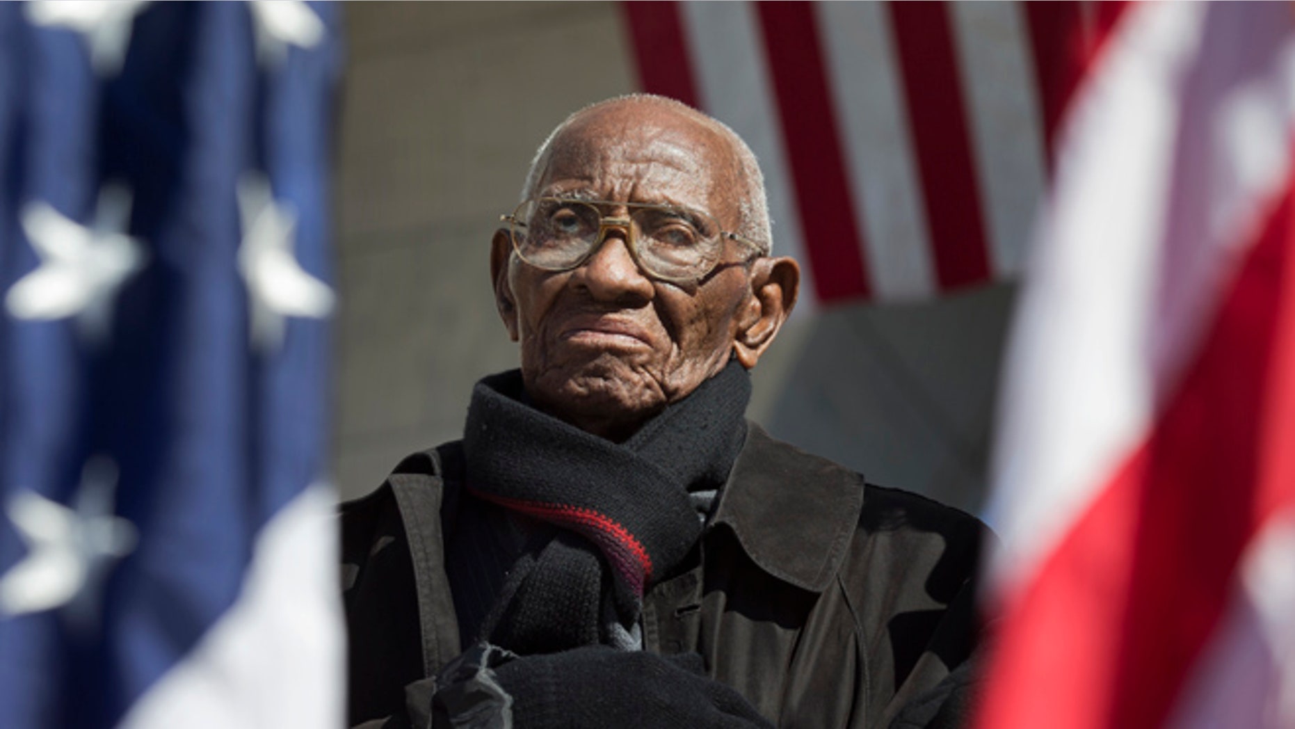 Richard Overton, the oldest living WWII veteran, listens during a Veterans Day ceremony at Arlington National Cemetery in Arlington, Va., in 2013.