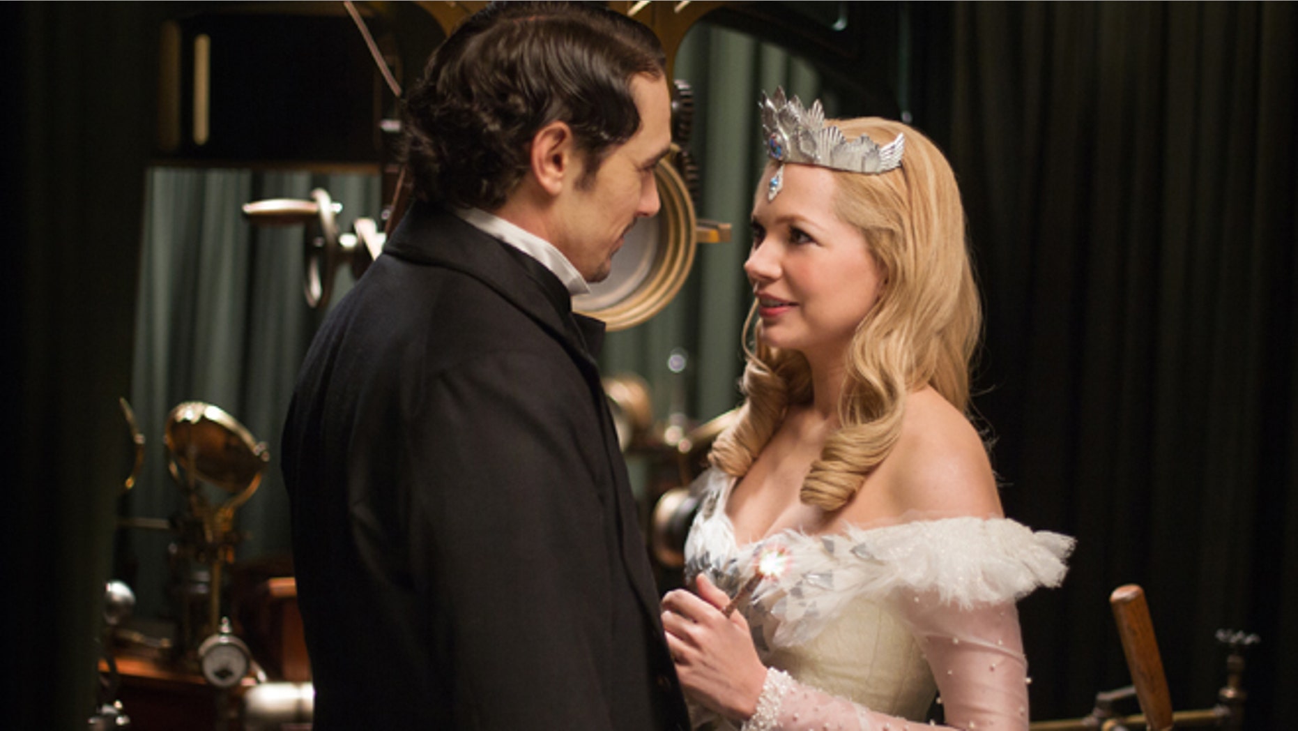 This film image released by Disney Enterprises shows James Franco, left, and Michelle Williams in a scene from "Oz the Great and Powerful."