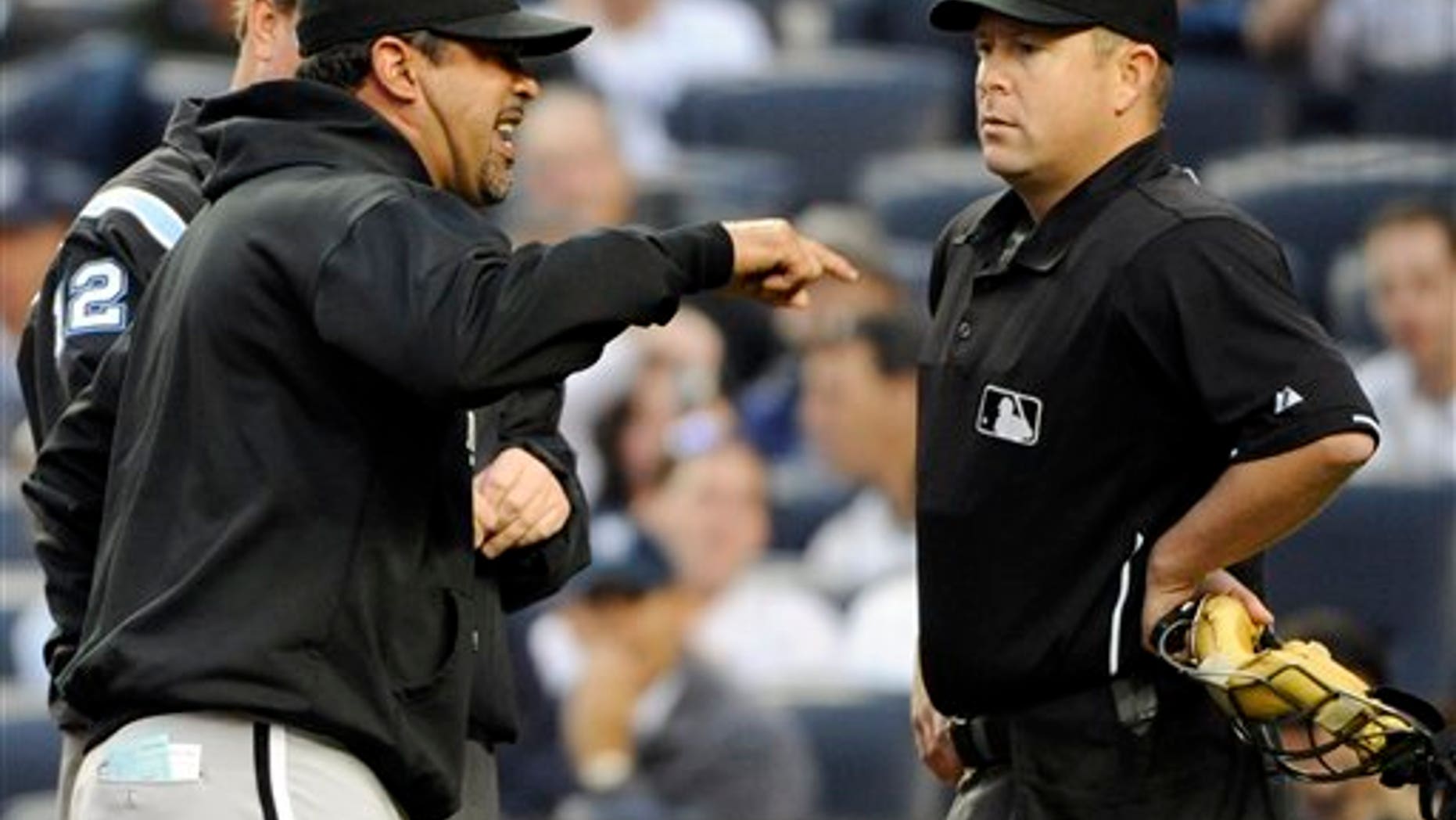Chicago White Sox mamager Ozzie Guillen, left, argues with home plate umpire Todd Tichenor during the first inning of a baseball game against the New York Yankees, Wednesday, April 27, 2011, at Yankee Stadium in New York. (AP Photo/Bill Kostroun)
