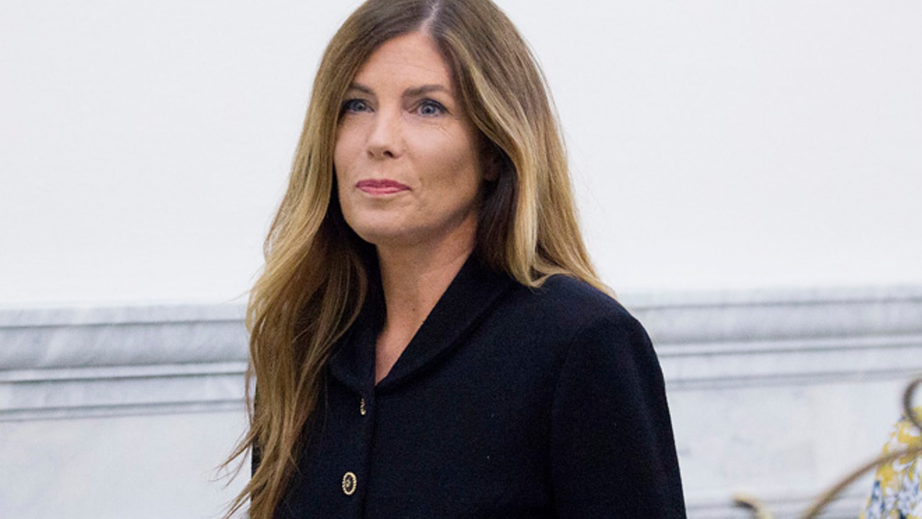 Pennsylvania Attorney General Kathleen Kane walks down a hall at the Montgomery County Courthouse, Monday, Aug. 15, 2016, in Norristown, Pa., where closing arguments are expected during her perjury and obstruction trial. (Jessica Griffin/The Philadelphia Inquirer via AP, Pool)