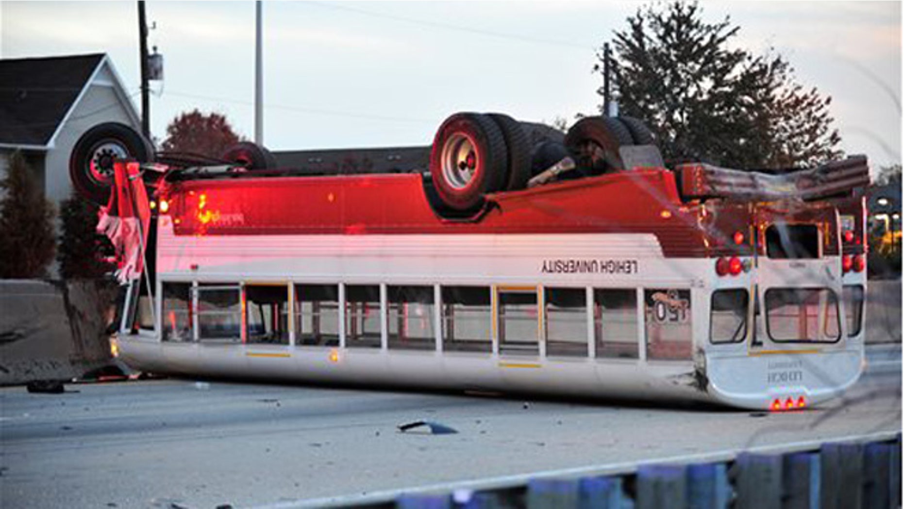 Oct. 27, 2015: A Lehigh University school bus remains on the scene following a fatal accident involving a car in Bethlehem, Pa.