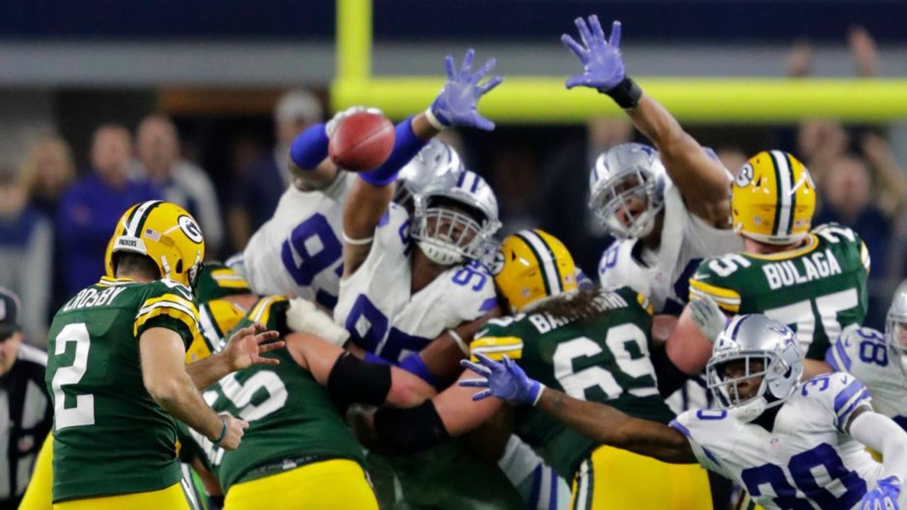Jan 15, 2017; Arlington, TX, USA; Green Bay Packers kicker Mason Crosby (2) kicks the game winning field goal against the Dallas Cowboys in the NFC Divisional playoff game at AT&T Stadium. Mandatory Credit: Dan Powers/The Post-Crescant via USA TODAY NETWORK