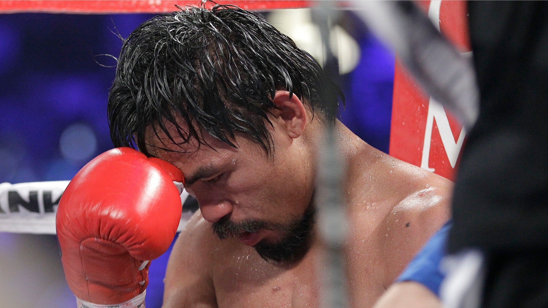 Manny Pacquiao sits in his corner after the 10th round of his bout against Timonthy Bradley. June 9th, 2012. (AP Photo/Julie Jacobson)