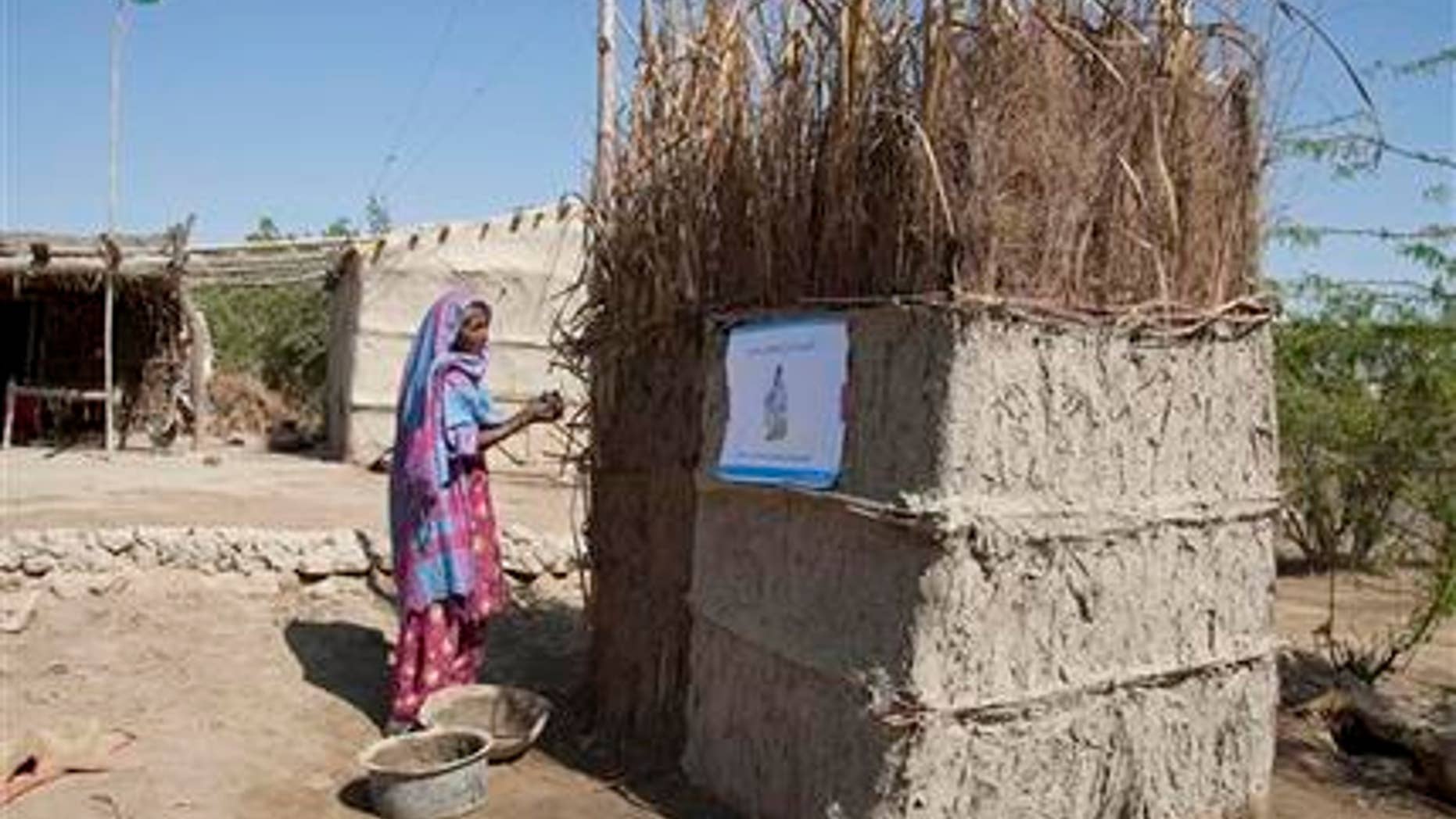 March 3, 2015: In this photo, a Pakistani villager builds a toilet in Thatta district, Sindh province, 62 miles southeast of Karachi, Pakistan.