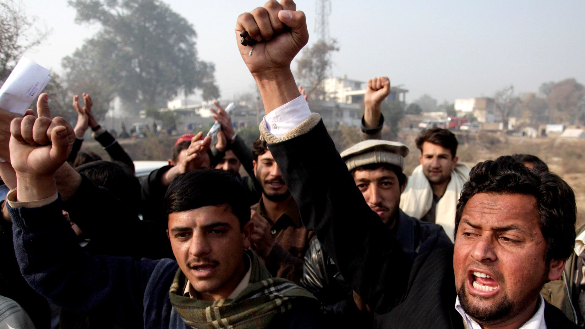 Pakistani students chant slogans to condemn the killing of Punjab's governor Salman Taseer in Peshawar, Pakistan Saturday, Jan. 8, 2011. (AP)