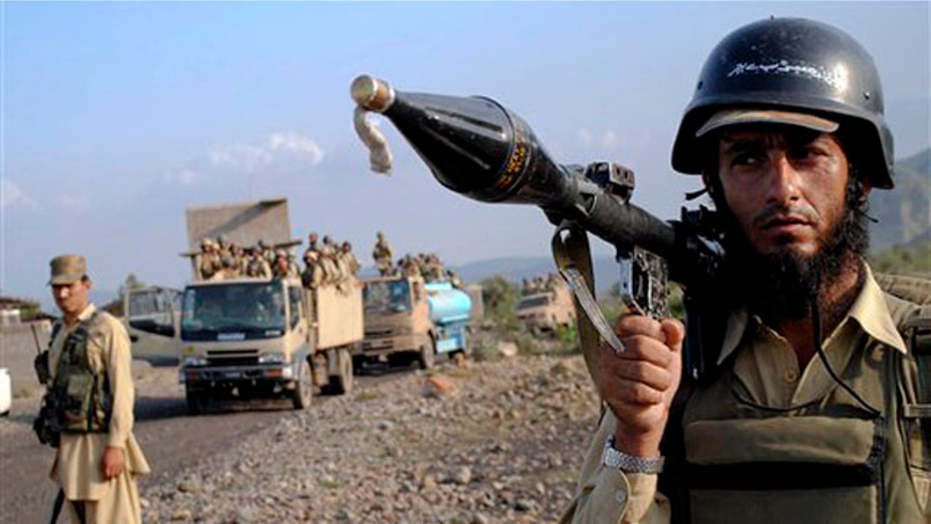 A Pakistani paramilitary soldier secures an area as other troops move toward a forward base during a military operation against militants in the Khurram tribal region July 9.