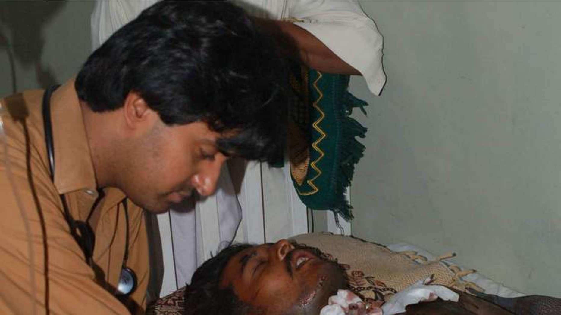 A doctor cares for the man who suffered life-threatening injuries from an acid attack.