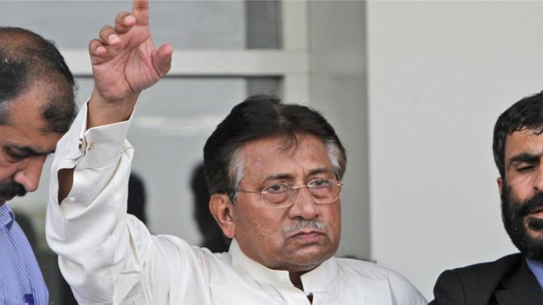 March 24, 2013: Former Pakistani President Pervez Musharraf, gestures upon his arrival to Karachi airport, Pakista.