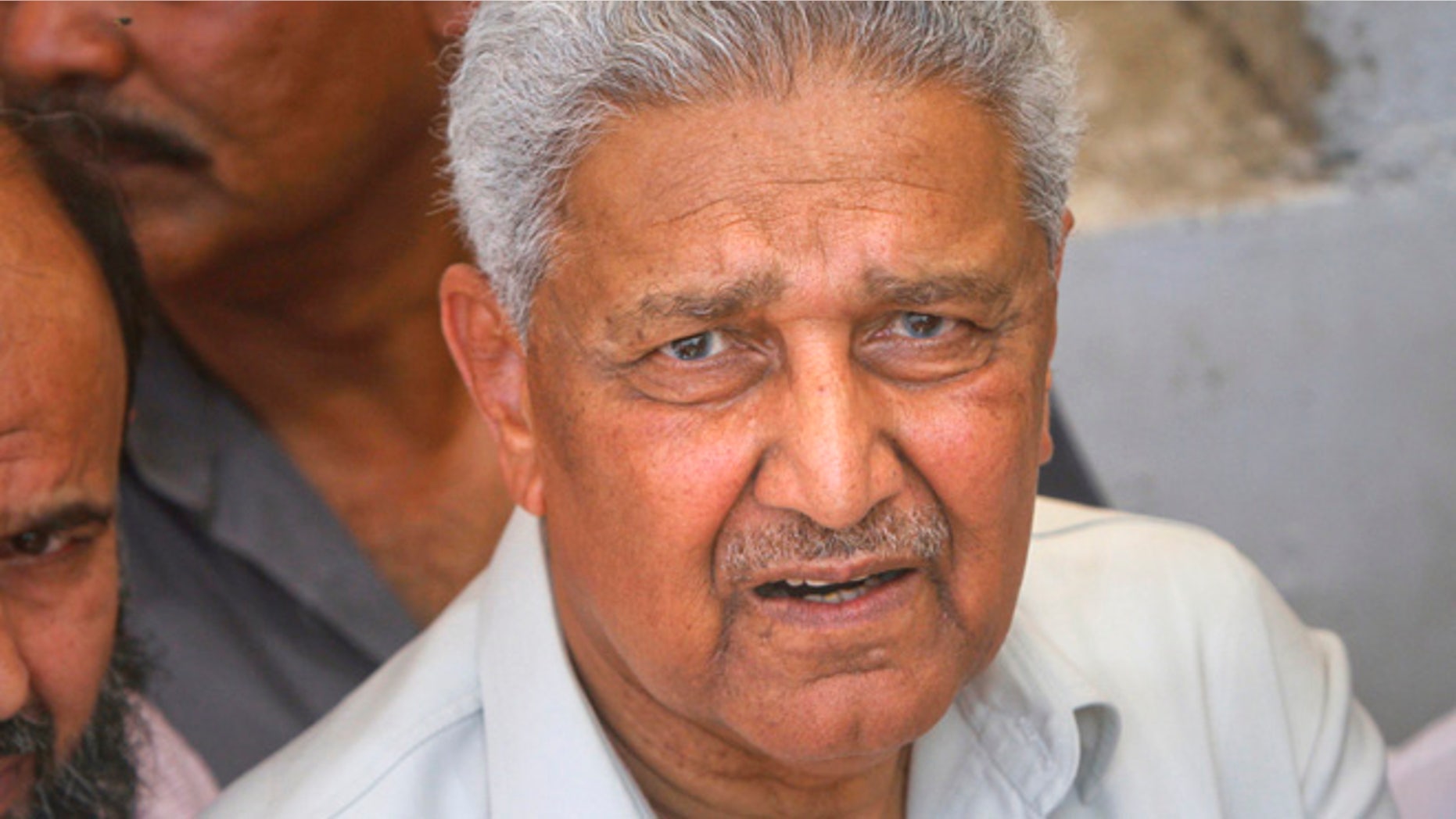 May 8, 2011: Pakistani nuclear scientist Abdul Qadeer Khan is photographed after a silent prayer over the grave of his brother Abdul Rauf Khan, during funeral services in Karachi. (Reuters)