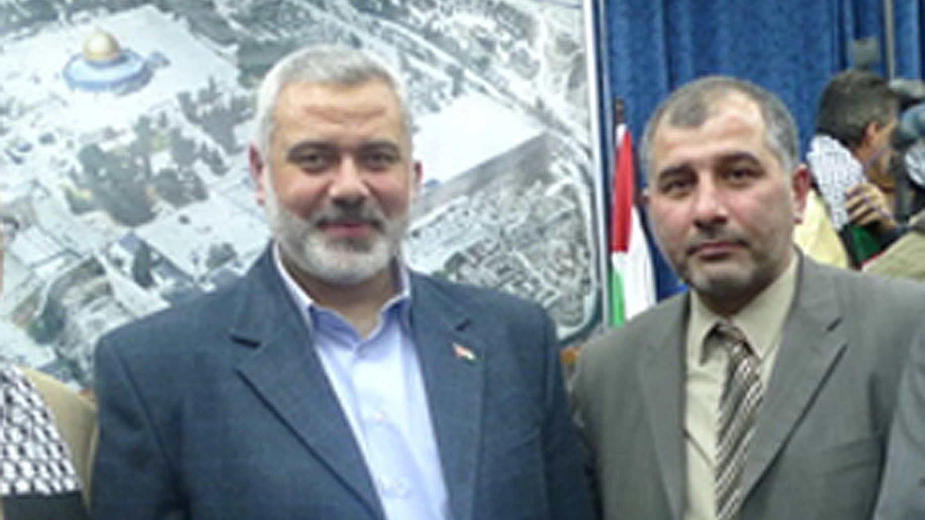 Hamas leader Ismail Haniyeh, (l.), with Majed Al-Zeer, director-general of the Palestinian Return Centre. (UN Watch)