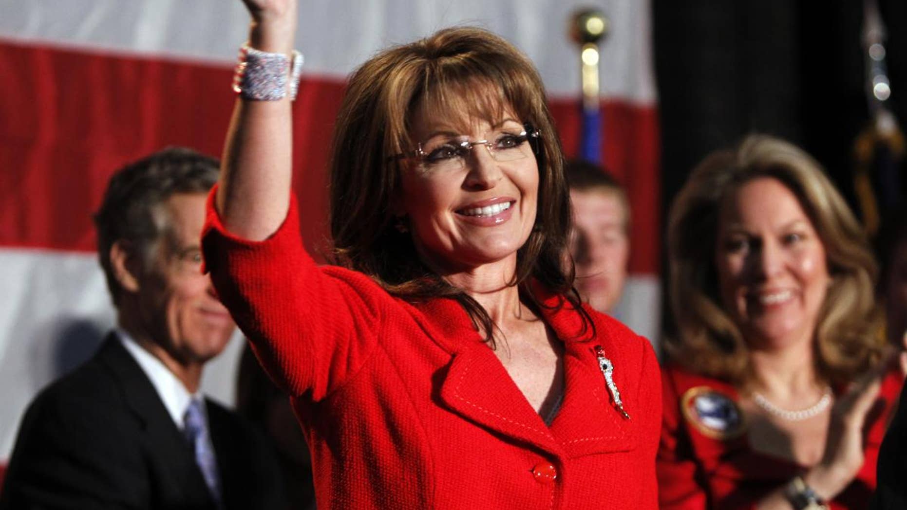 In this May 2, 2011, file photo, former Alaska Governor Sarah Palin waves during a fundraiser at Colorado Christian University in Lakewood, Colo. (AP Photo/Ed Andrieski)