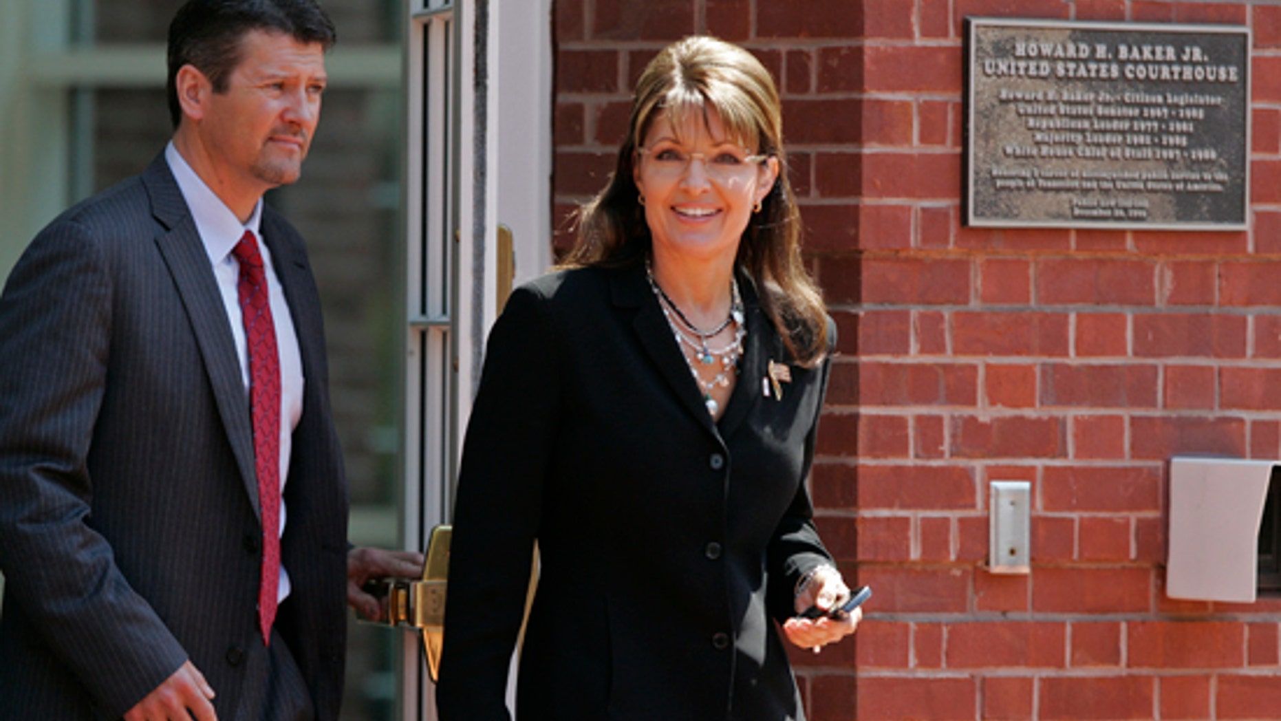 Friday: Former Alaska Gov. Sarah Palin leaves the Federal Courthouse in Knoxville, Tenn., with her husband Todd Palin. (AP)