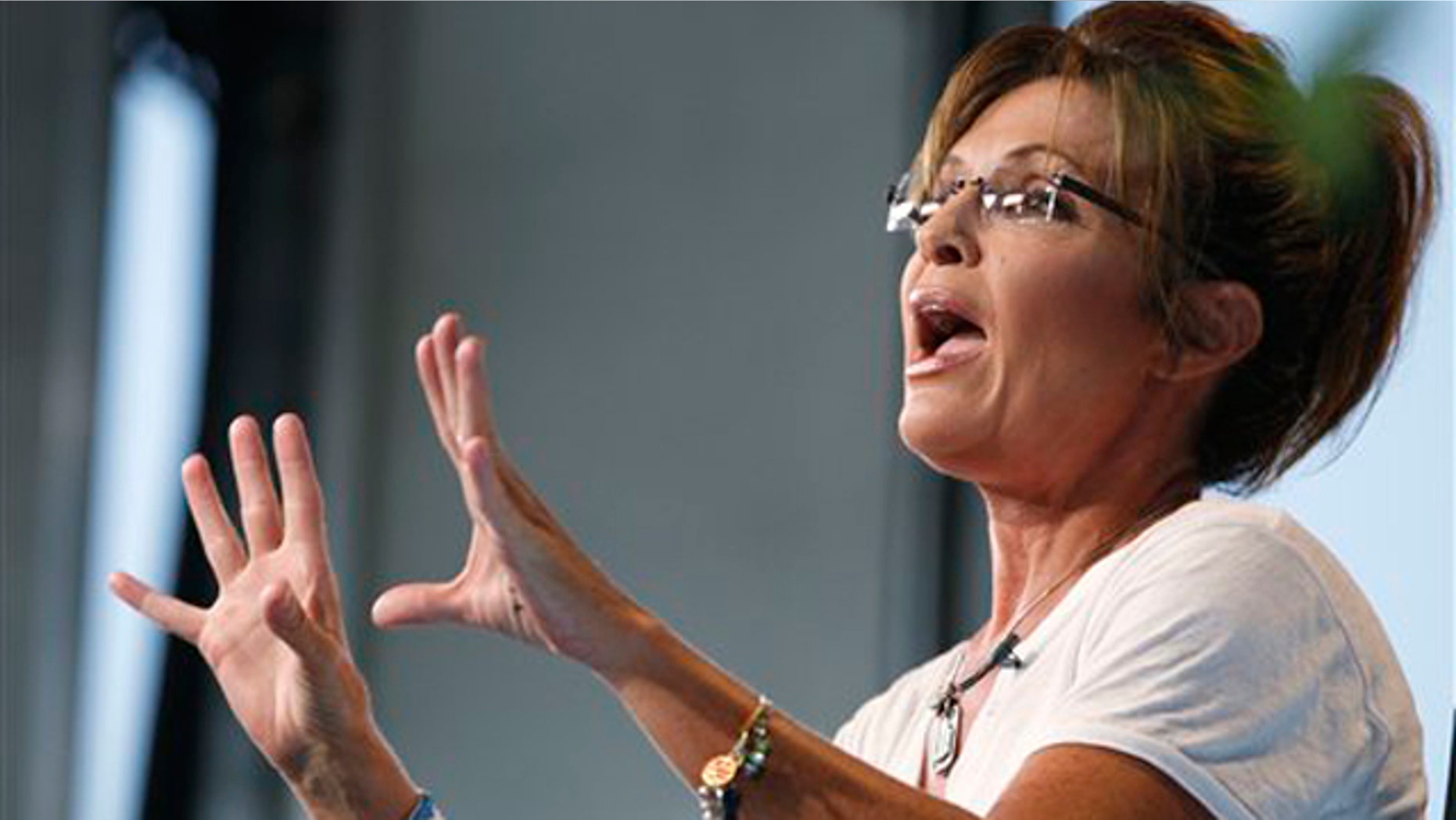 Former Alaska Gov. Sarah Palin speaks as she is interviewed by Fox News at the Iowa State Fair in Des Moines, Iowa, Aug. 12.