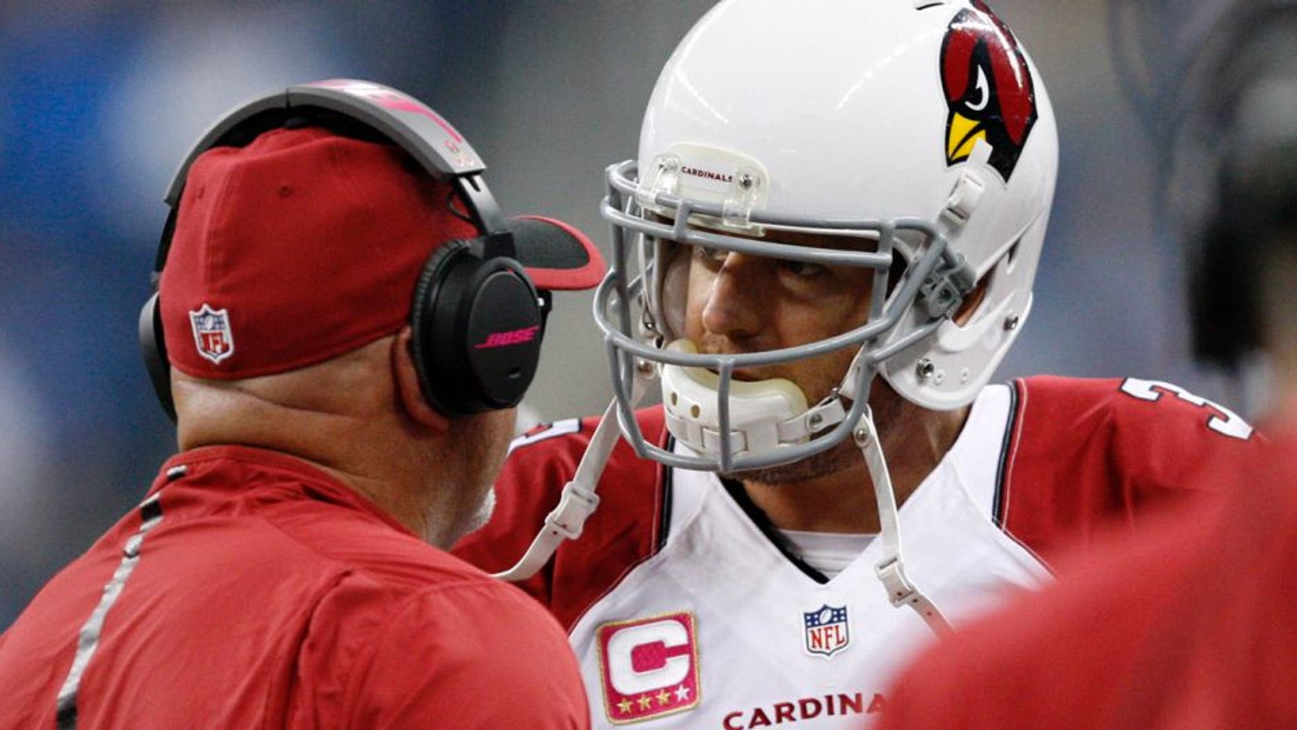 Oct 11, 2015; Detroit, MI, USA; Arizona Cardinals quarterback Carson Palmer (3) talks to head coach Bruce Arians right before the first quarter against the Detroit Lions at Ford Field. Mandatory Credit: Raj Mehta-USA TODAY Sports
