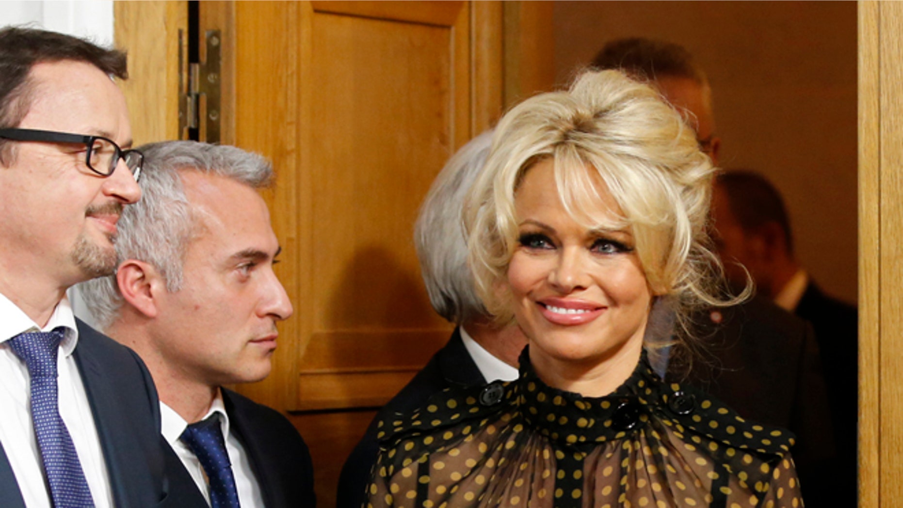 January 19, 2016. Pamela Anderson arrives at a news conference to protest the force-feeding of geese used in the production of foie gras, in Paris, France.