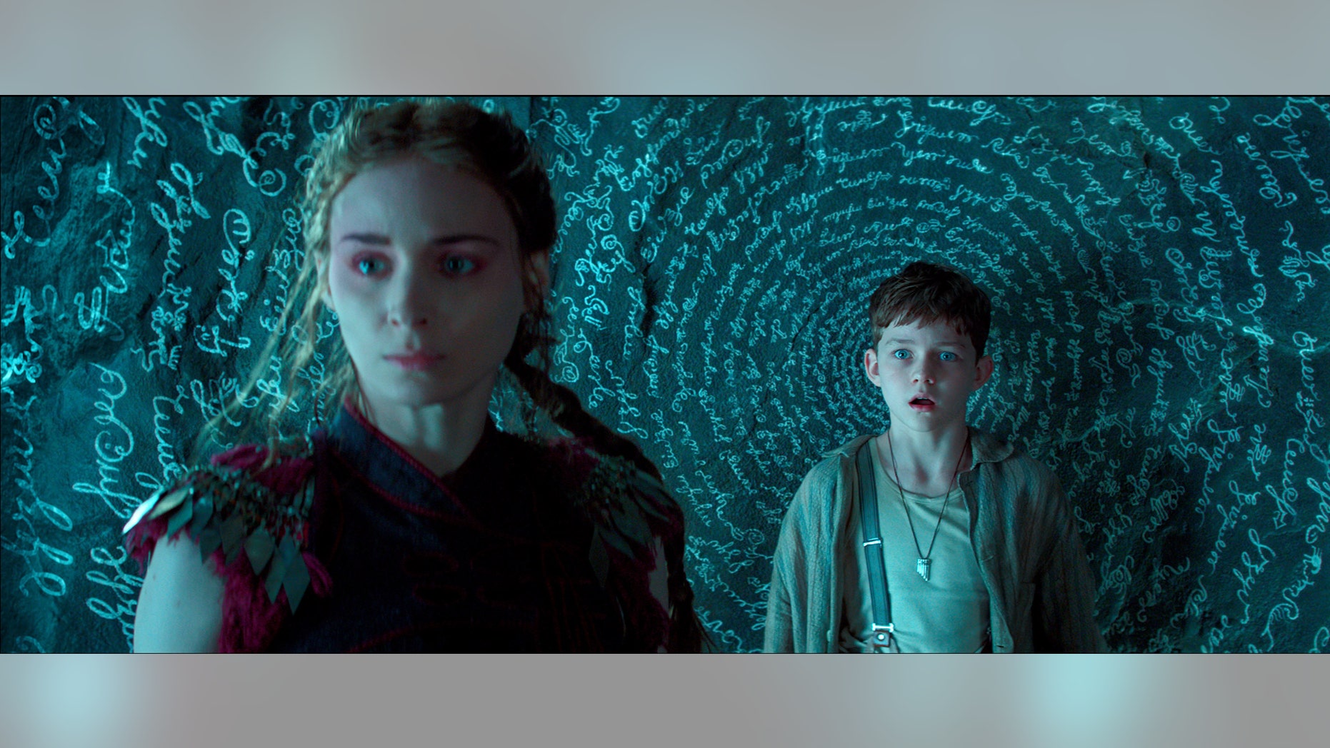 Rooney Mara, left, as Tiger Lily, and Levi Miller as Peter, in a scene from the film "Pan."