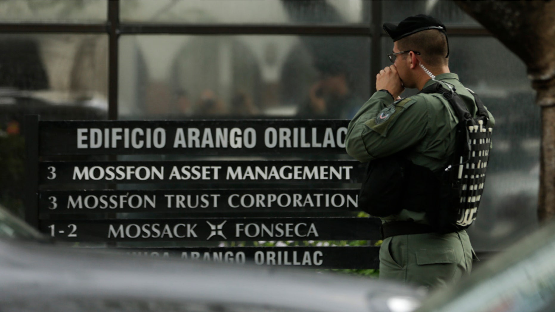 April 12, 2016: A police officer stands outside the Mossack Fonseca law firm while organized crime prosecutors raid its offices in Panama City