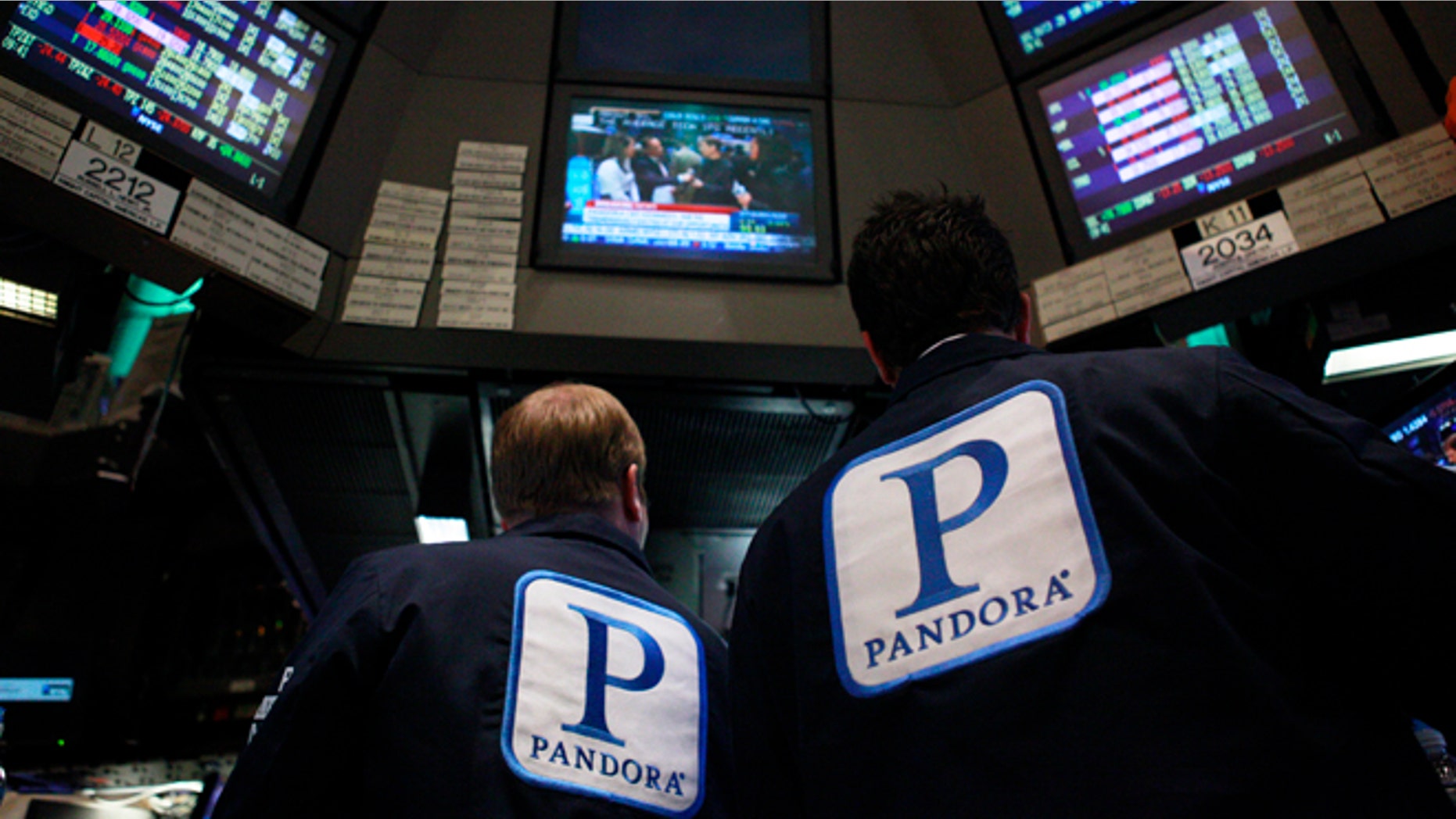 June 15, 2011: Traders work at the kiosk where Pandora Internet radio is traded on the floor of the New York Stock Exchange.