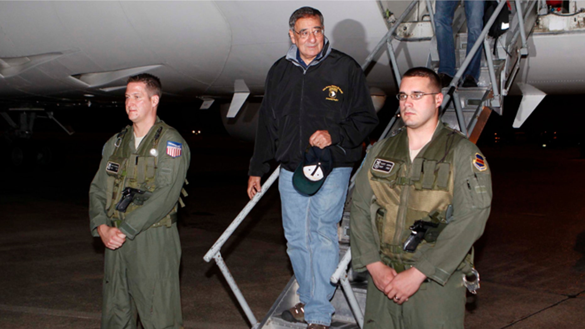 Sept. 16, 2012: U.S. Defense Secretary Leon Panetta, center, steps off his jet after arriving at Yokota Air Base on the outskirts of Tokyo, Japan.