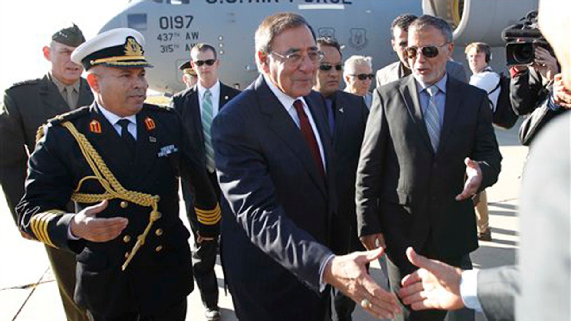 Dec. 17, 2011: Defense Secretary Leon Panetta greets officials in Tripoli, Libya.