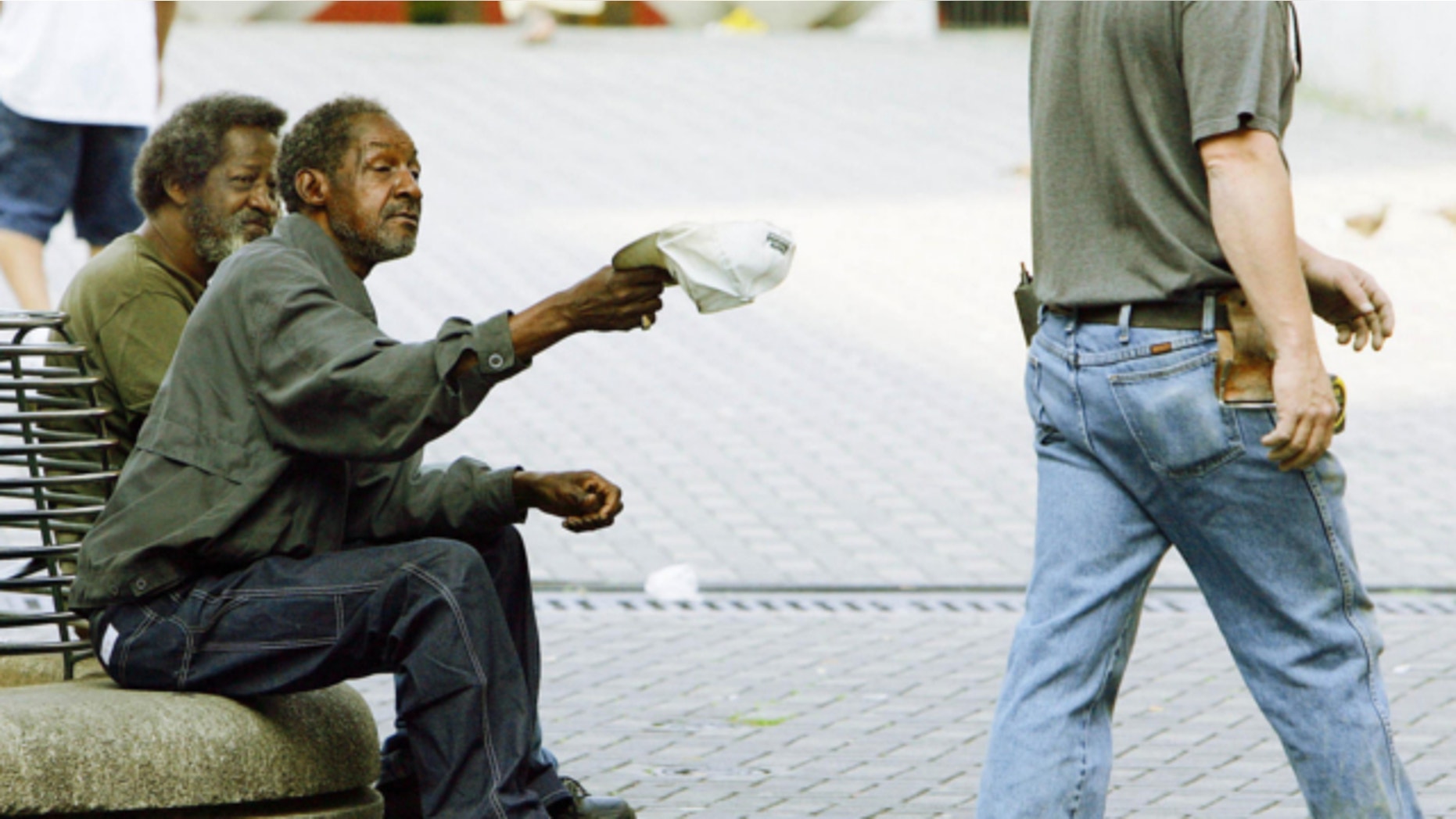 FILE: A law passed in Middle Township will require panhandleers to get permits in an attempt to combat aggressive panhandling and to limit the areas where they can ask for money.