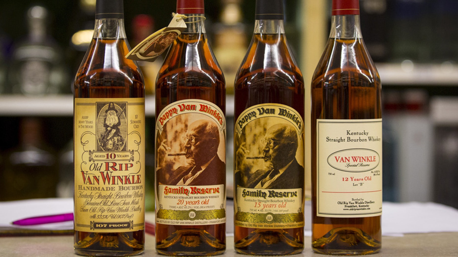 Bottles of Pappy Van Winkle are displayed in a liquor store.