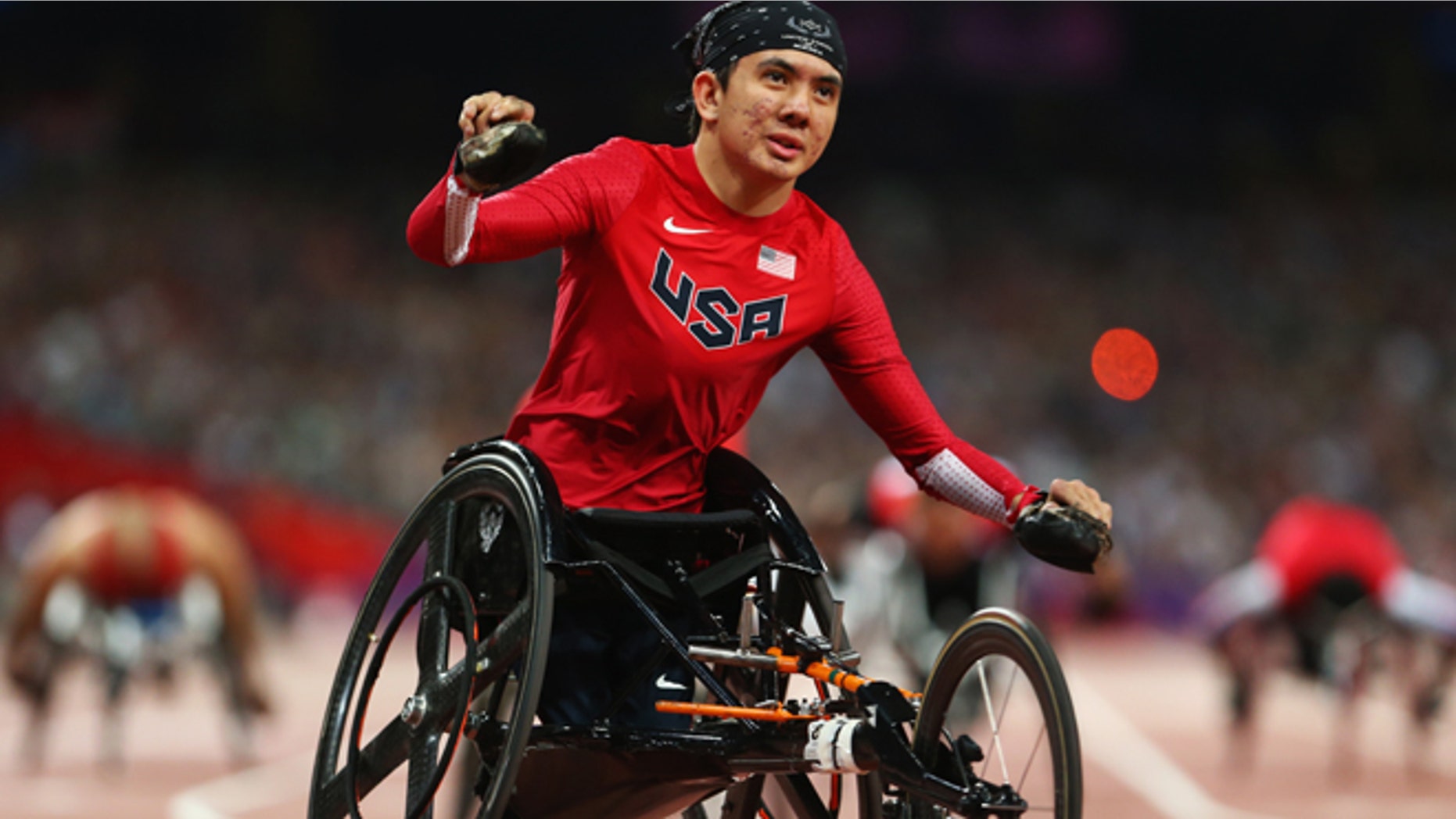 LONDON, ENGLAND - SEPTEMBER 08: Raymond Martin of the United States celebrates as he wins gold in the Men's 200m T52 Final on day 10 of the London 2012 Paralympic Games at Olympic Stadium on September 8, 2012 in London, England. (Photo by Michael Steele/Getty Images)
