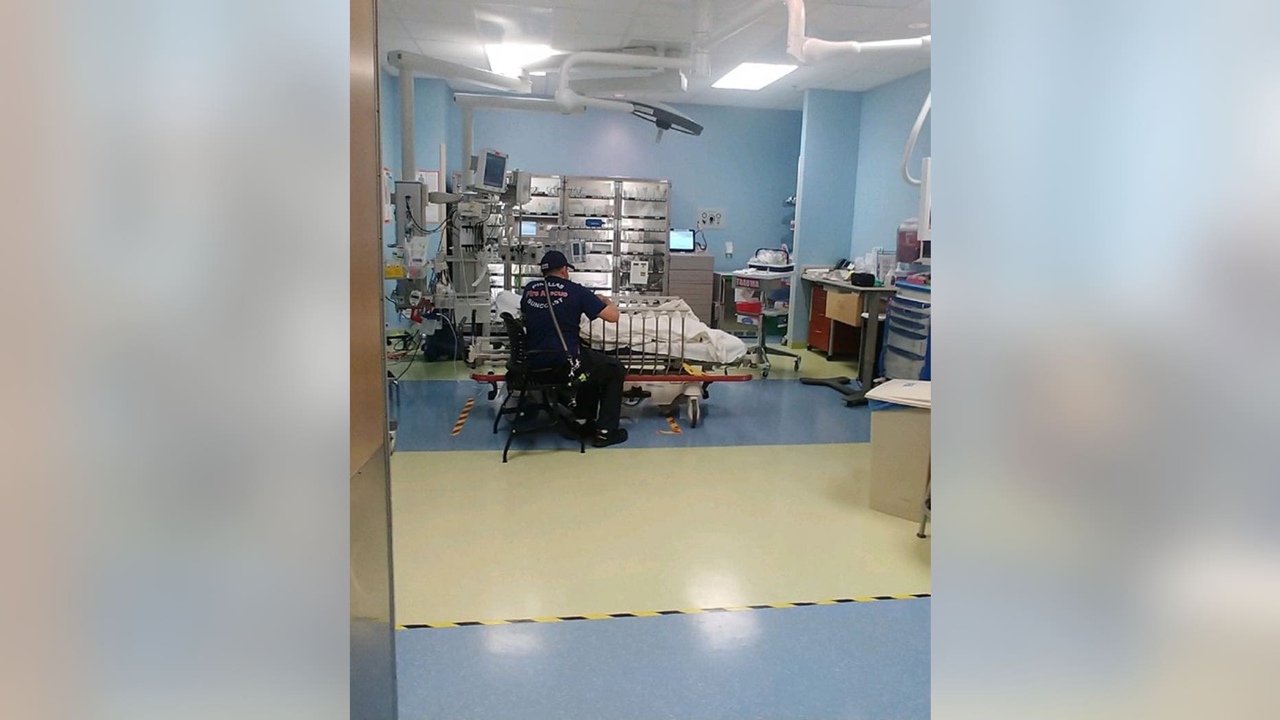 Doug Higley stayed by the girl's side and talked about her favorite Disney princesses as they waited for her parents to arrive at the hospital.