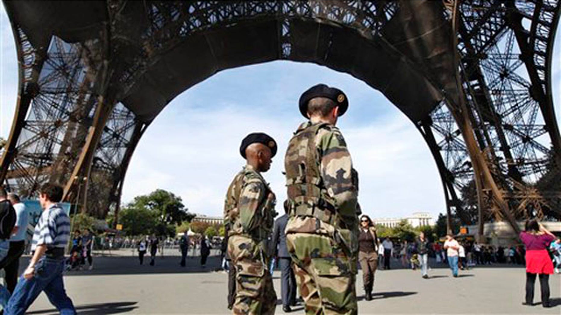French soldiers patrol under the Eiffel Tower in Paris Oct. 3. (AP Photo)
