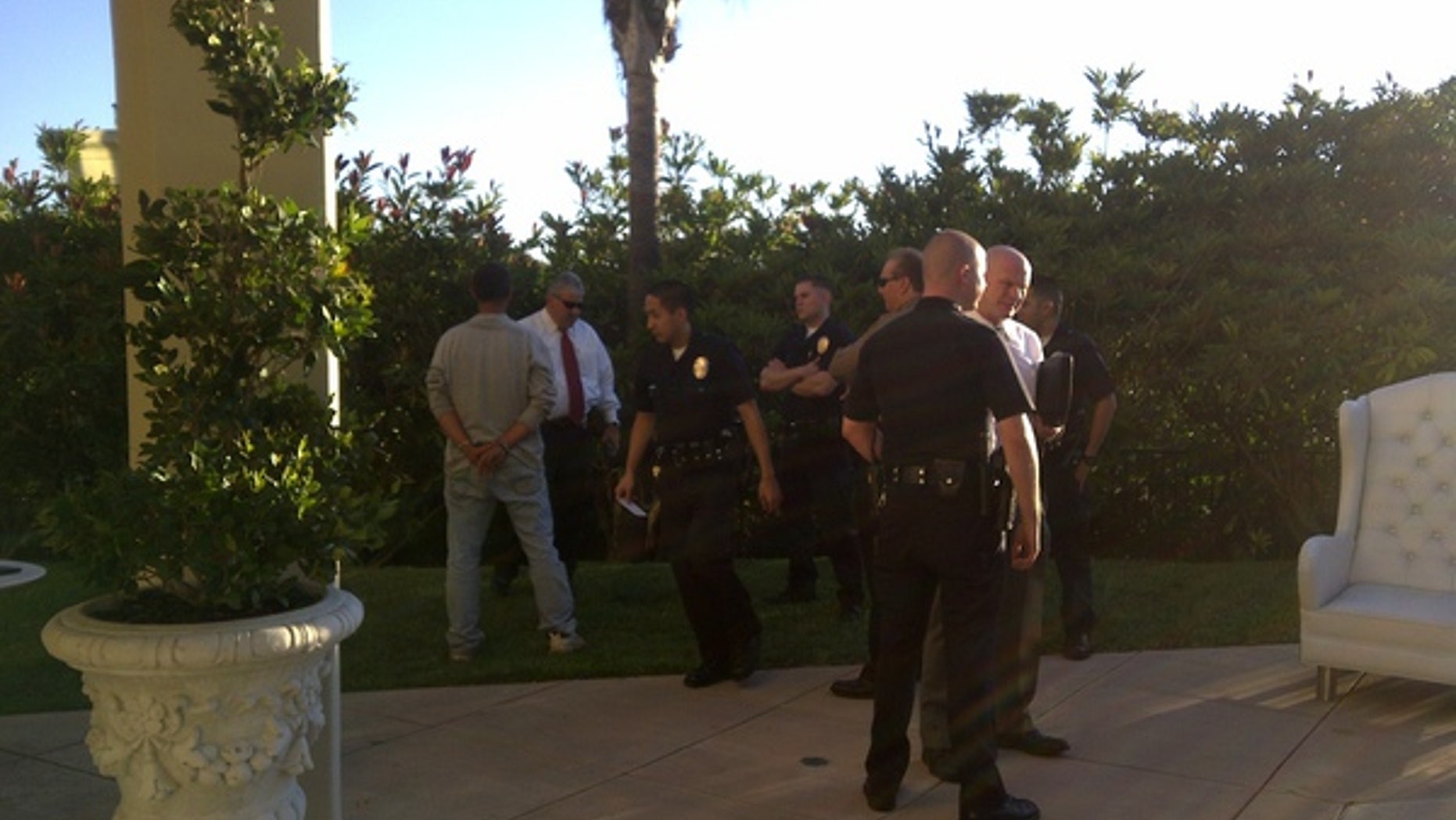 Paris Hilton photographed the man being arrested. (Twitpic)