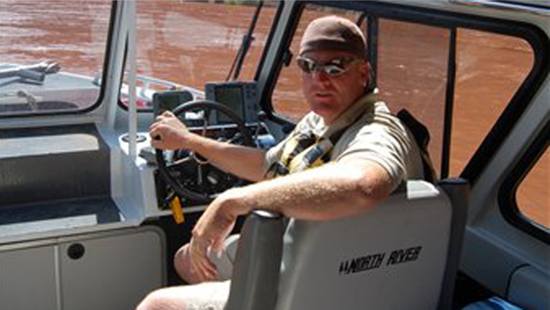 This undated photo provided by Utah State Parks and Recreation, shows Utah State Ranger Brody Young. Nearly 100 officers tracking a gunman in a rugged Utah canyon Saturday, Nov. 20, 2010, were believed to be closing in on the suspect accused of shooting and critically wounding Young.
