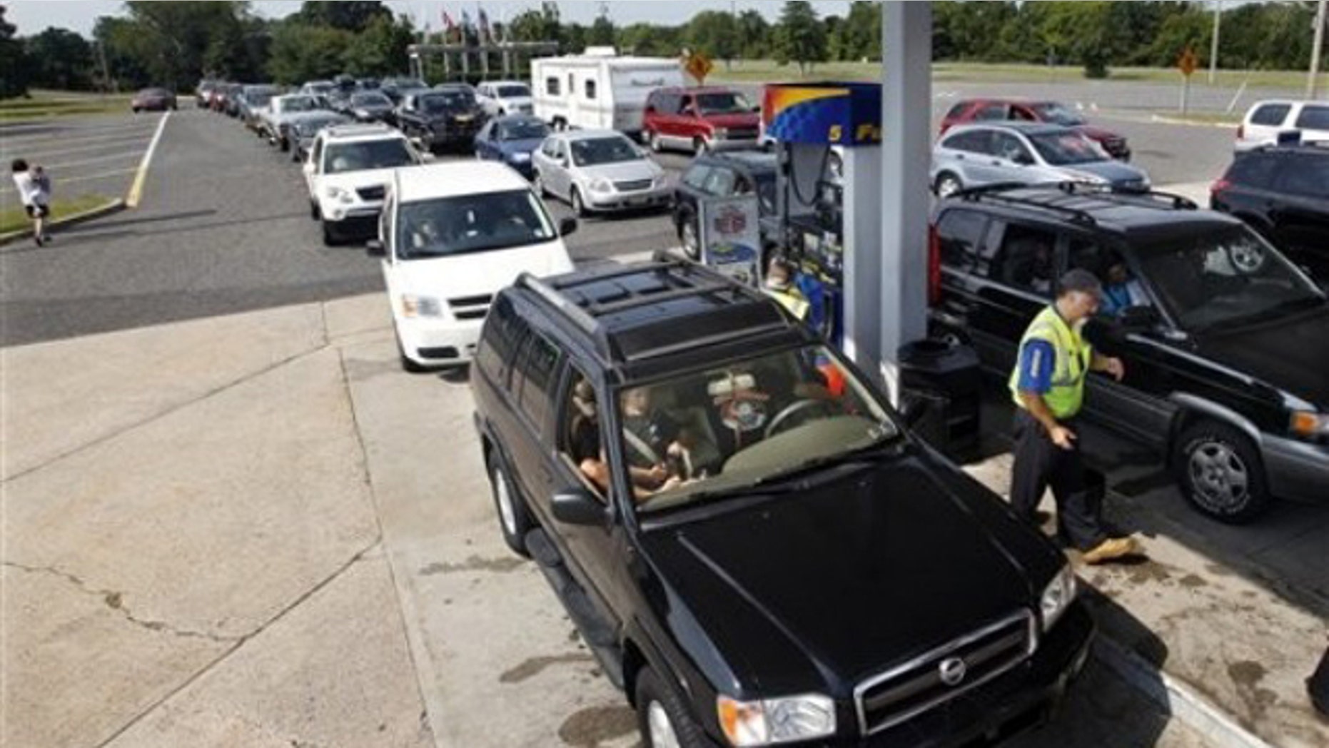 Aug. 26, 2011: Vehicles line up to get gas at a service area on the Garden State Parkway near Ocean View, N.J.