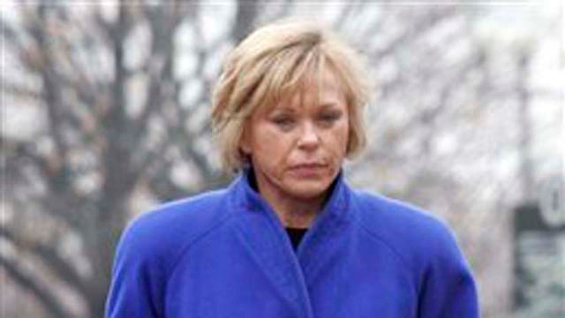 FILE -- A Feb. 4, 2008 file photo shows Rebecca Parrett returning from a lunch break at the Federal Courthouse in Columbus, Ohio. The FBI said Wednesday OIct. 27, 2010 that Parrett, who fled two years ago after being convicted in a massive corporate fraud case has been arrested in Mexico. (AP Photo/The Columbus Dispatch, Tom Dodge)